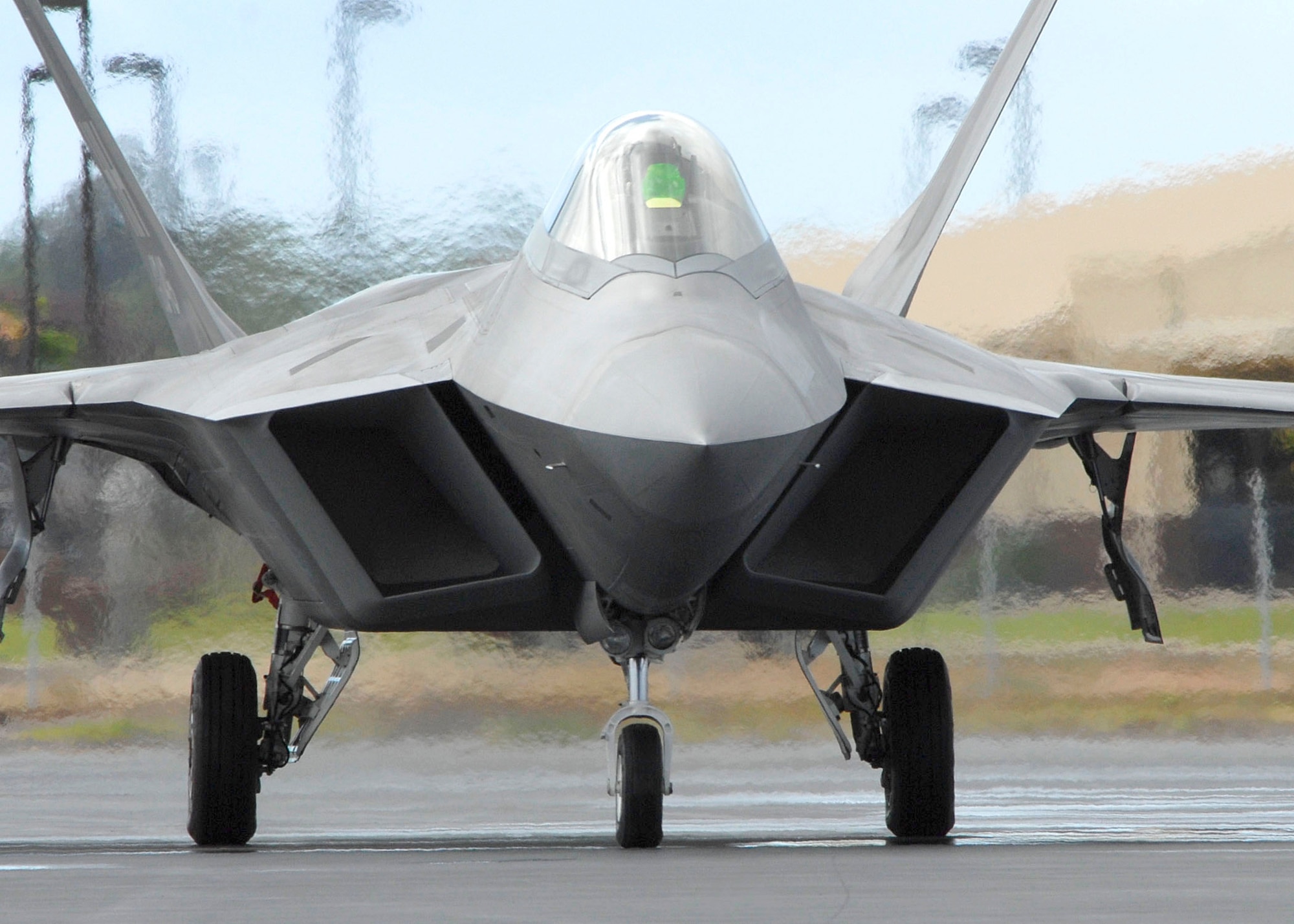A pilot taxies in an F-22 on the flightline July 9, 2010, at Joint Base Pearl Harbor-Hickam, Hawaii. The Hawaii Air National Guard's 199th Fighter Squadron is transitioning from the F-15 Eagle and will serve as the only ANG led joint guard and active-duty squadron in the Pacific. (U.S. Air Force photo/Tech Sgt. Jerome S. Tayborn)