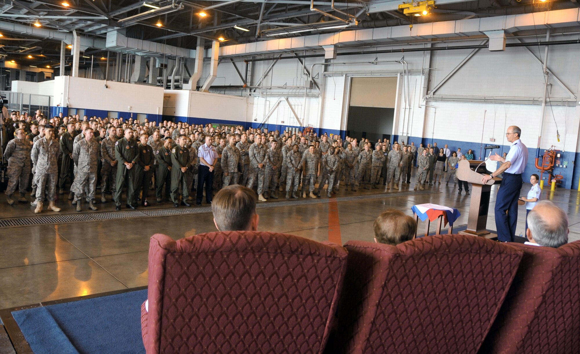OFFUTT AIR FORCE BASE, Neb. - Gen. Kevin P. Chilton, commander of U.S. Strategic Command, congratulates more than 300 members of the 55th Wing July 7 before they were awarded the 2009 Omaha Trophy for strategic aircraft operations. The Omaha Trophy is awarded annually to four military units demonstrating the highest performance standards in U.S. Strategic Command mission areas, according to the command. 55th Wing Commander Brig. Gen. John N.T. Shanahan accepted the trophy at the Bennie Davis Maintenance Facility on behalf of all Fightin' Fifty Fifth members. U.S. Air Force photo by Jeff W. Gates.