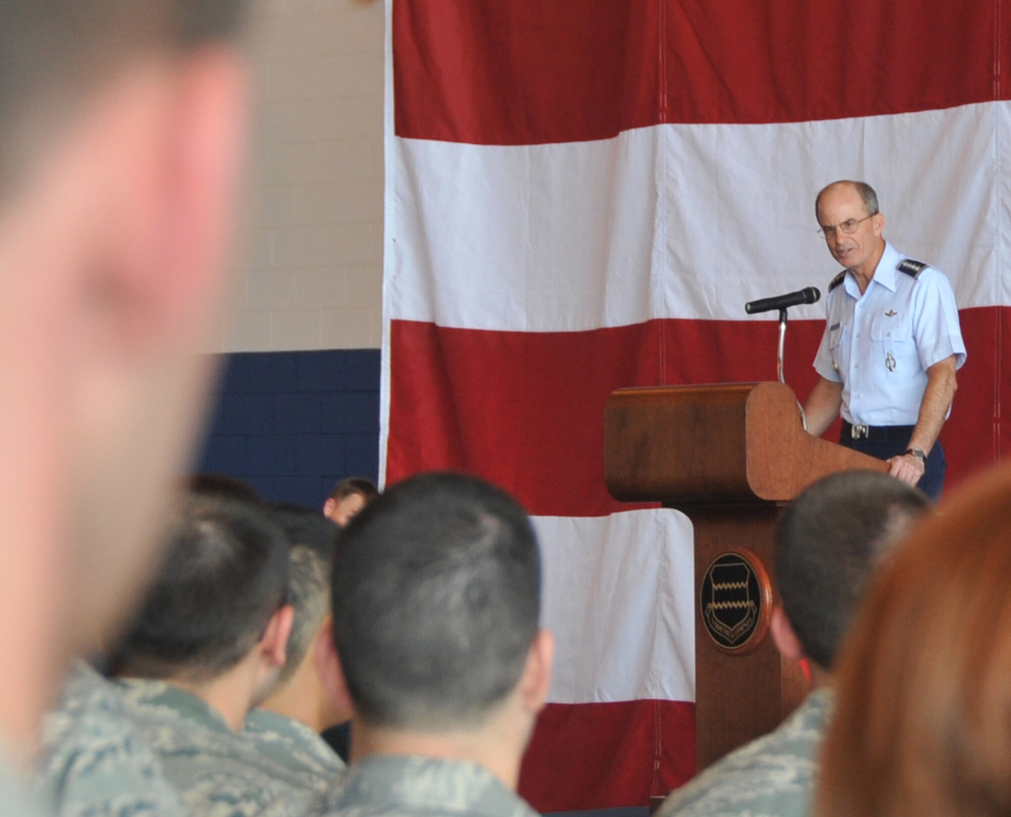 OFFUTT AIR FORCE BASE, Neb. - Gen. Kevin P. Chilton, commander of U.S. Strategic Command, congratulates more than 300 members of the 55th Wing July 7 before they were awarded the 2009 Omaha Trophy for strategic aircraft operations. The Omaha Trophy is awarded annually to four military units demonstrating the highest performance standards in U.S. Strategic Command mission areas, according to the command. 55th Wing Commander Brig. Gen. John N.T. Shanahan accepted the trophy at the Bennie Davis Maintenance Facility on behalf of all Fightin' Fifty Fifth members. U.S. Air Force photo by Jeff W. Gates.