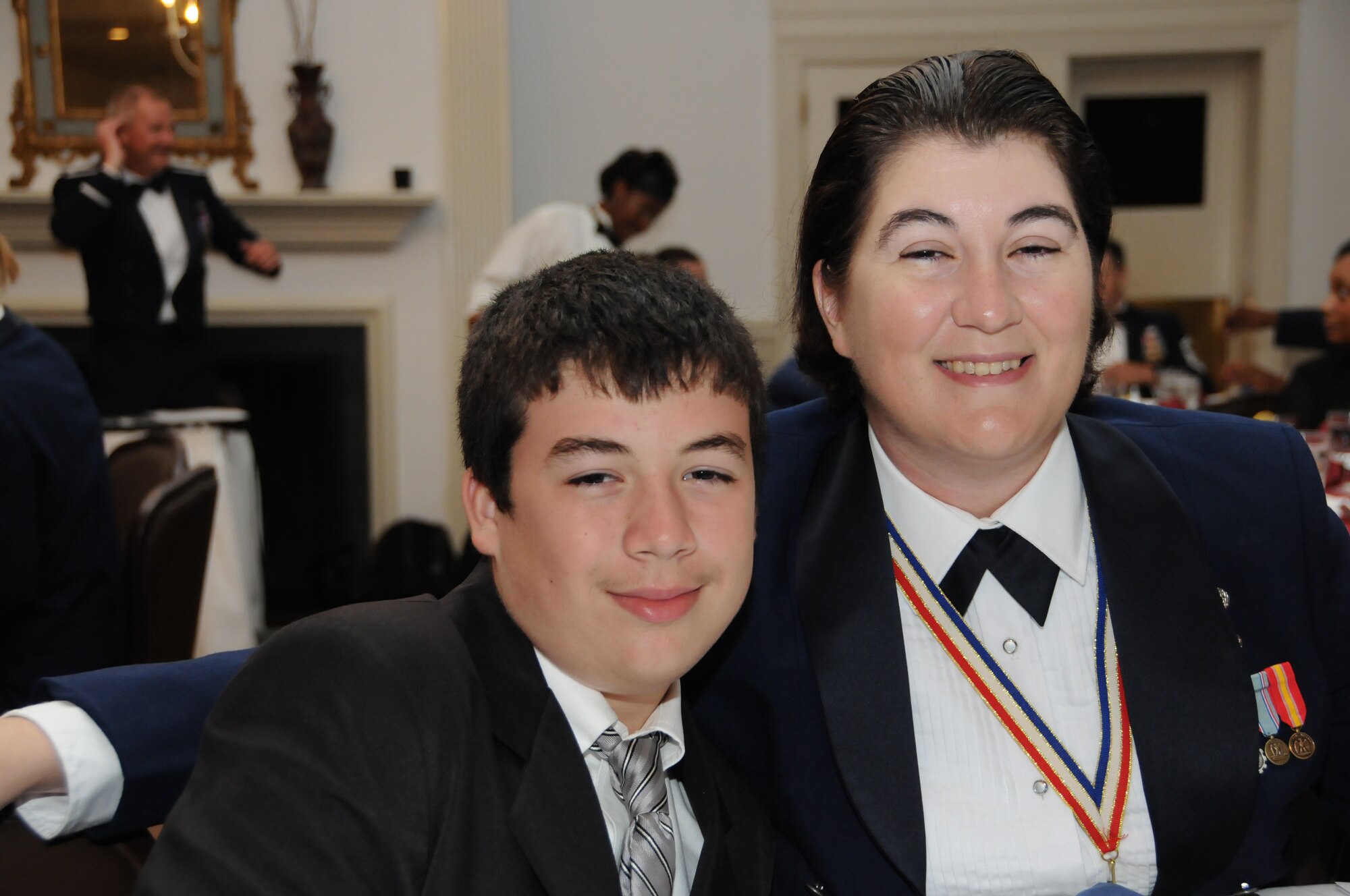 We think Master Sgt. Gillian Albro, 916th Mission Support first sergeant, had the youngest date there! Oh wait, that's her son! Both enjoyed the 916th's Dining Out ceremony in July. (USAF photo by TSgt. Gillian Albro, 916ARW/PA)