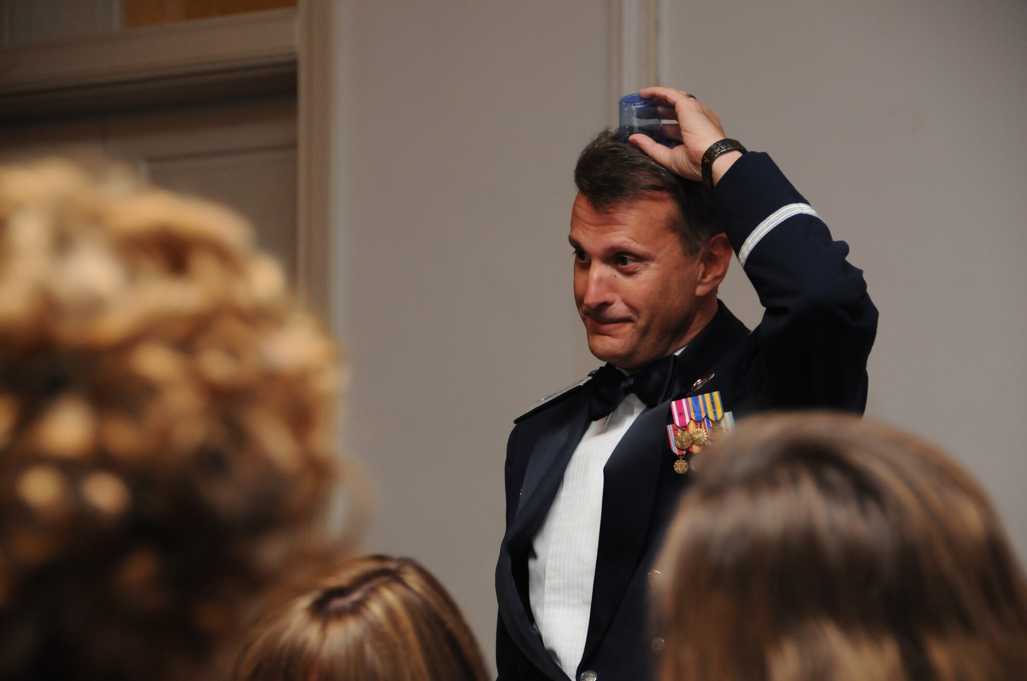 Even the wing commander messes up occassionally. Col. Randy Ogden, 916th commander, shows that his grog cup is empty during the wing's Dining Out and Induction Ceremony. (USAF photo by TSgt. Scotty Sweatt, 916ARW/PA)