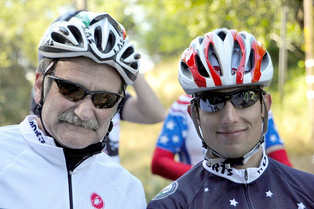 Staff Sgt. Marc Esposito and actor/comedian Robin Williams May 22, 2010, in San Francisco. Sergeant Esposito is participating in Sea to Shining Sea, a 4,000-mile bike ride which started at the Golden Gate Bridge and will end July 24, 2010, in Virginia Beach, Va. The goal of the ride is to honor the courage of our service men and women, recognize the strength of the American spirit and challenge perceptions of how we view athletes. Sergeant Esposito is from the 21st Special Tactics Squadron at Pope Air Force Base, N.C. (Courtesy photo/Van Brinson)