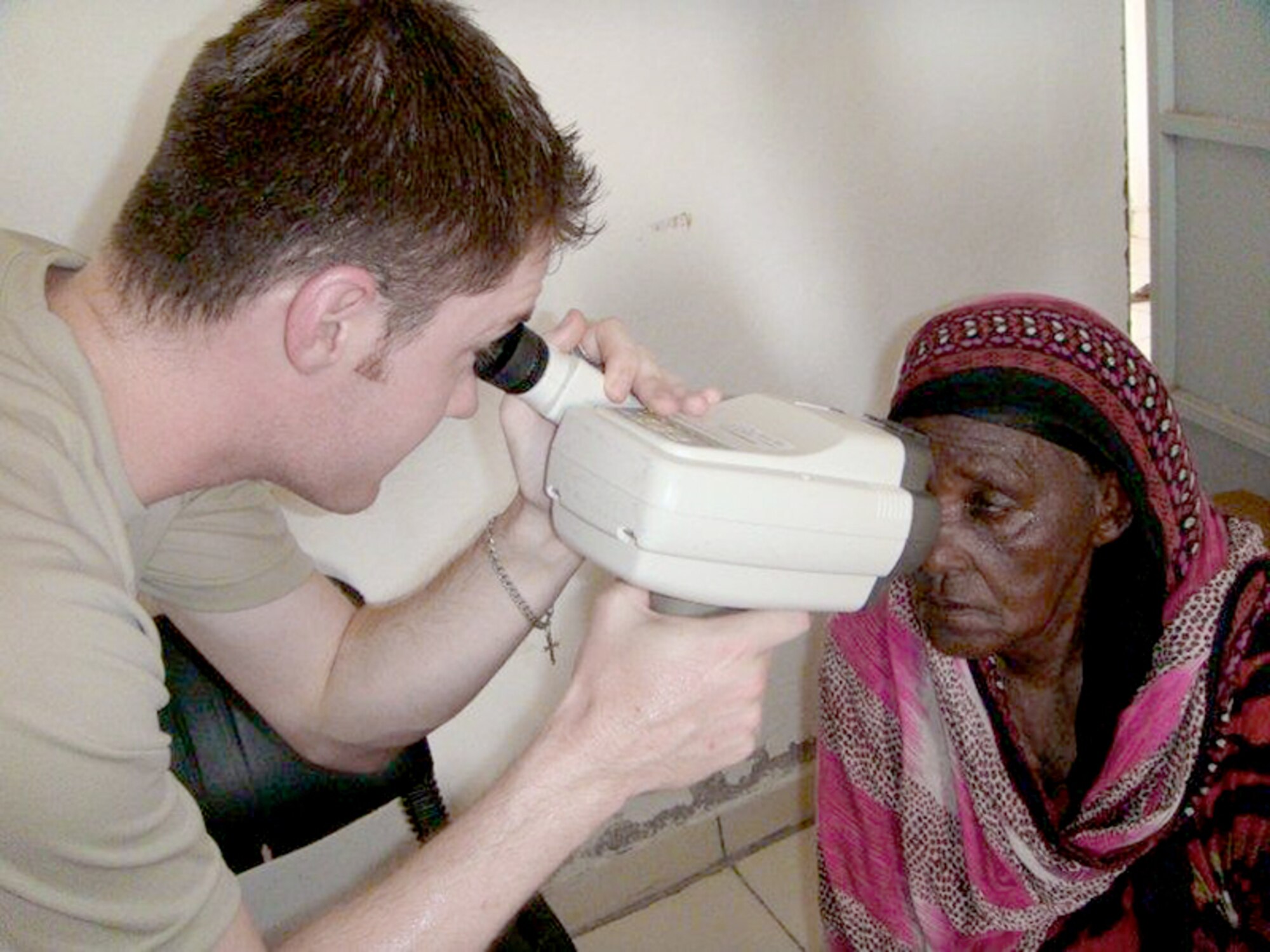 Staff Sgt. Travis Harris pre-screens a patient June 3, 2010 during a Medical Civic Action Program in Djibouti, Africa. The 48th Aerospace Medicine Squadron team received and treated patients with a wide variety of ocular health conditions. Sergeant Harris is an optometrist assistant assigned to the 48th AMDS. (U.S. Air Force photo/Tech. Sgt. Sarah Mayersky) 
