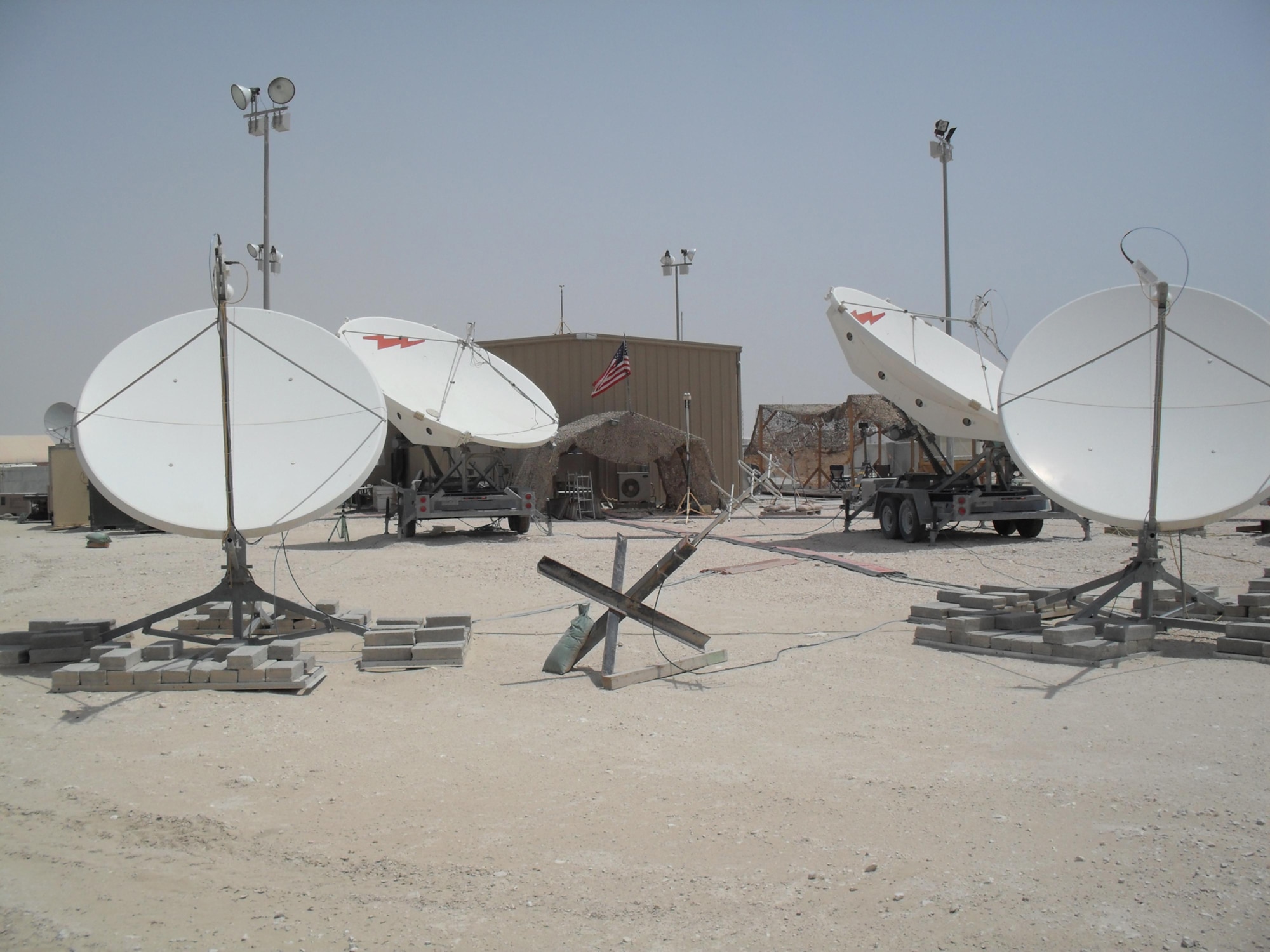 RAIDRS Deployable Ground Segment Zero antennas are used by Airmen of the 16th and 380th Space Control Squadrons to detect interference on mission critical satellite communication links in Southwest Asia. The 16th and 380th Space Control Squadrons achieved a historic milestone recently when their deployed mission, Operation Silent Sentry, surpassed five years of continuous deployed operations. (U.S. Air Force photo)