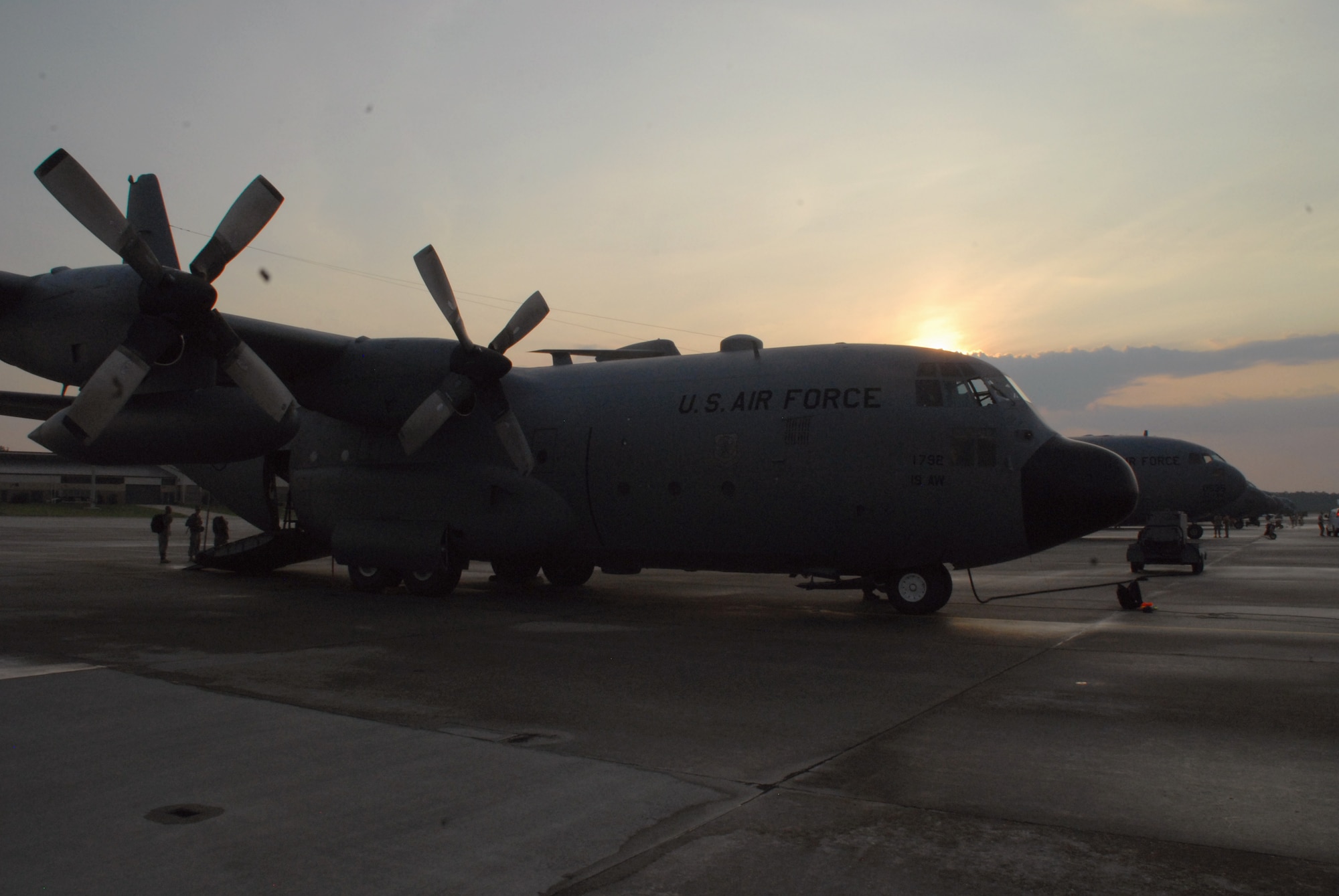 A C-130E Hercules from the 53rd Airlift Squadron, Little Rock Air Force Base, Ark., sits in a long row of C-130s and C-17 Globemaster IIIs June 22, 2010 before a joint forcible entry exercise at Pope AFB, N.C. Four crews from Little Rock AFB joined 14 others from various Air Force Bases to form the largest formation ever assembled for a JFEE June 22, 2010 through June, 2010 at Pope AFB and Fort Bragg, N.C. (U.S. Air Force photo/Capt. Joe Knable)
