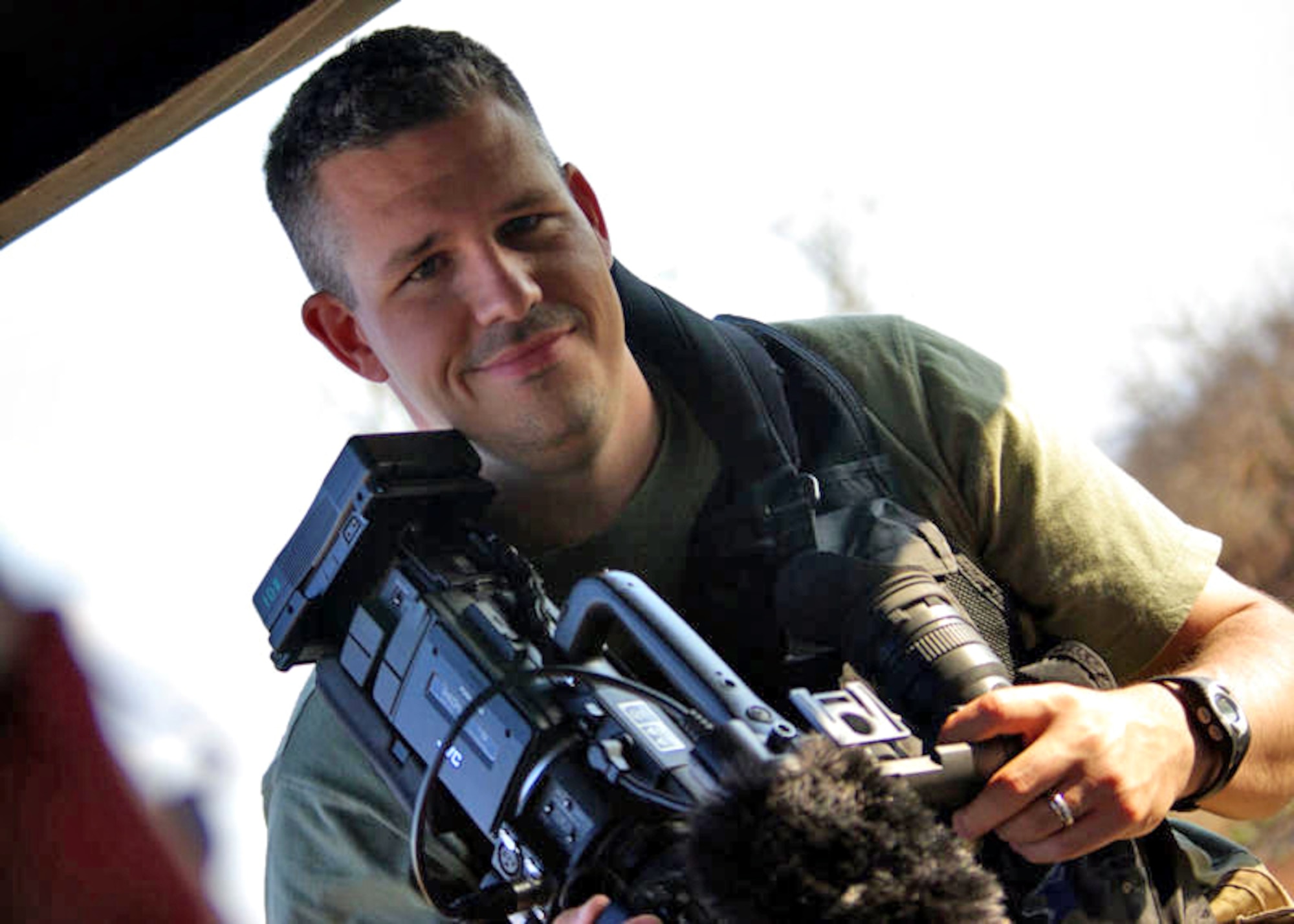 HLANE ROYAL NATIONAL PARK, Kingdom of Swaziland - Staff Sgt. Matthew Bright 
provides video documentation support for a U.S. Africa Command military exercise August 9, 2009. After nearly being removed from service for weight problems, Sergeant Bright has begun a diet and exercise regimen that has helped him lose more than 50 pounds in the last year. (U.S. Air Force photo/Capt. James Nichols)