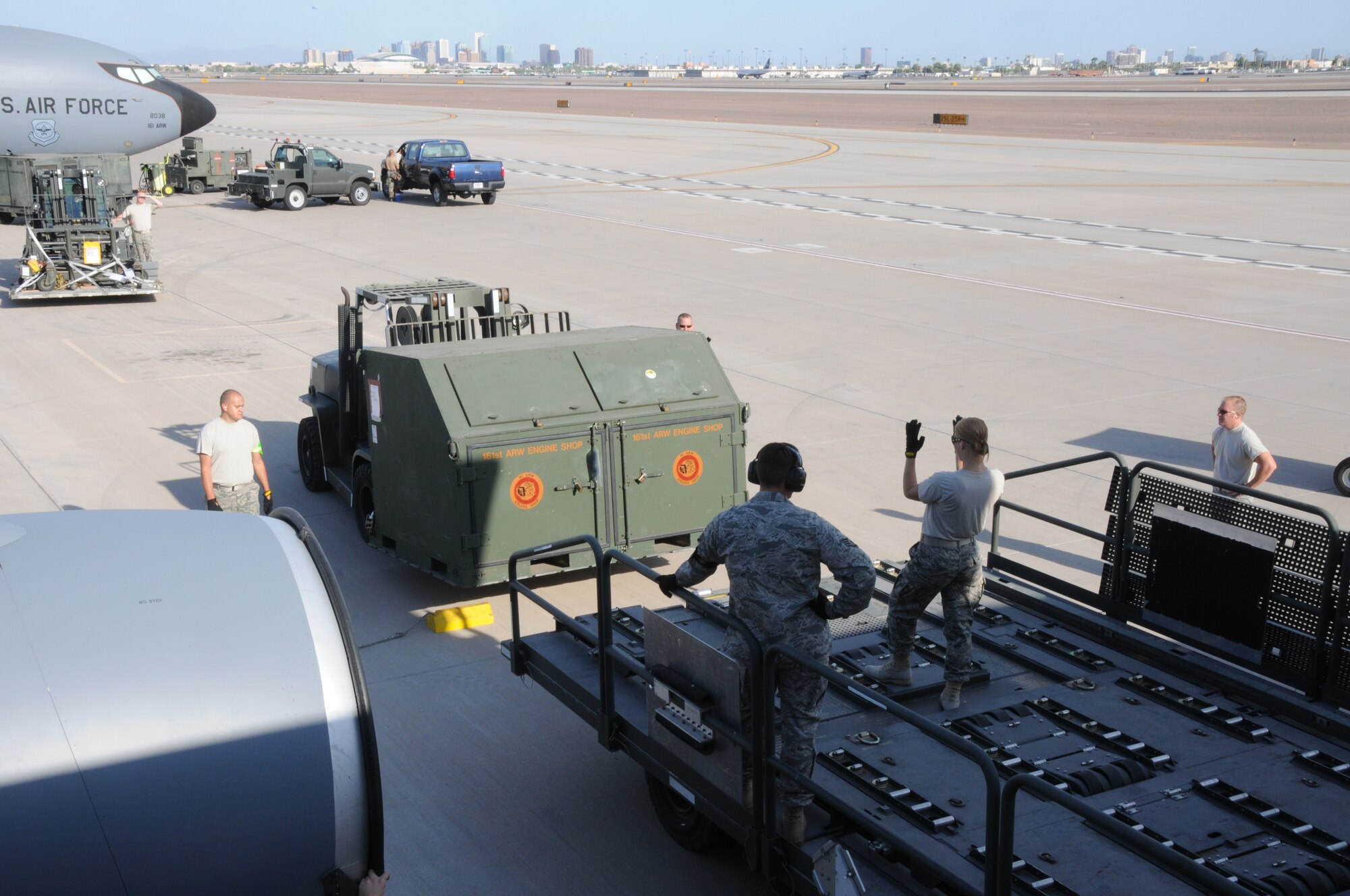 PHOENIX, AZ -- 161st Aerial Port Flight personnel conduct training by loading a KC-135R at Phoenix  Sky Harbor Air National Guard Base, July 11, 2010.  The aircraft will be flying on a real world mission somewhere across the Atlantic Ocean. (U.S. Air Force photo by Master Sgt. Charles M. Wade) (Released)