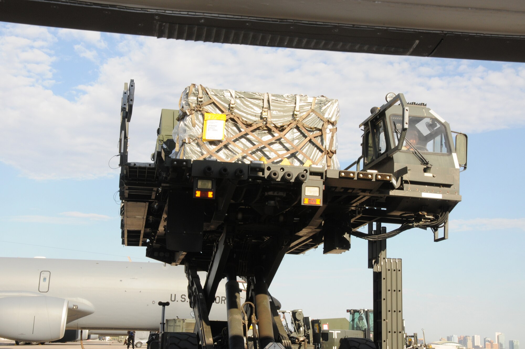 PHOENIX, AZ -- A K-Loader is guided closer to load a KC-135R. Personnel with 161st Aerial Port Flight conducted training at the same time a real world mission is preparing at Phoenix Sky Harbor Air National Guard Base, July 11, 2010. (U.S. Air Force photo by Master Sgt. Charles M. Wade) (Released)