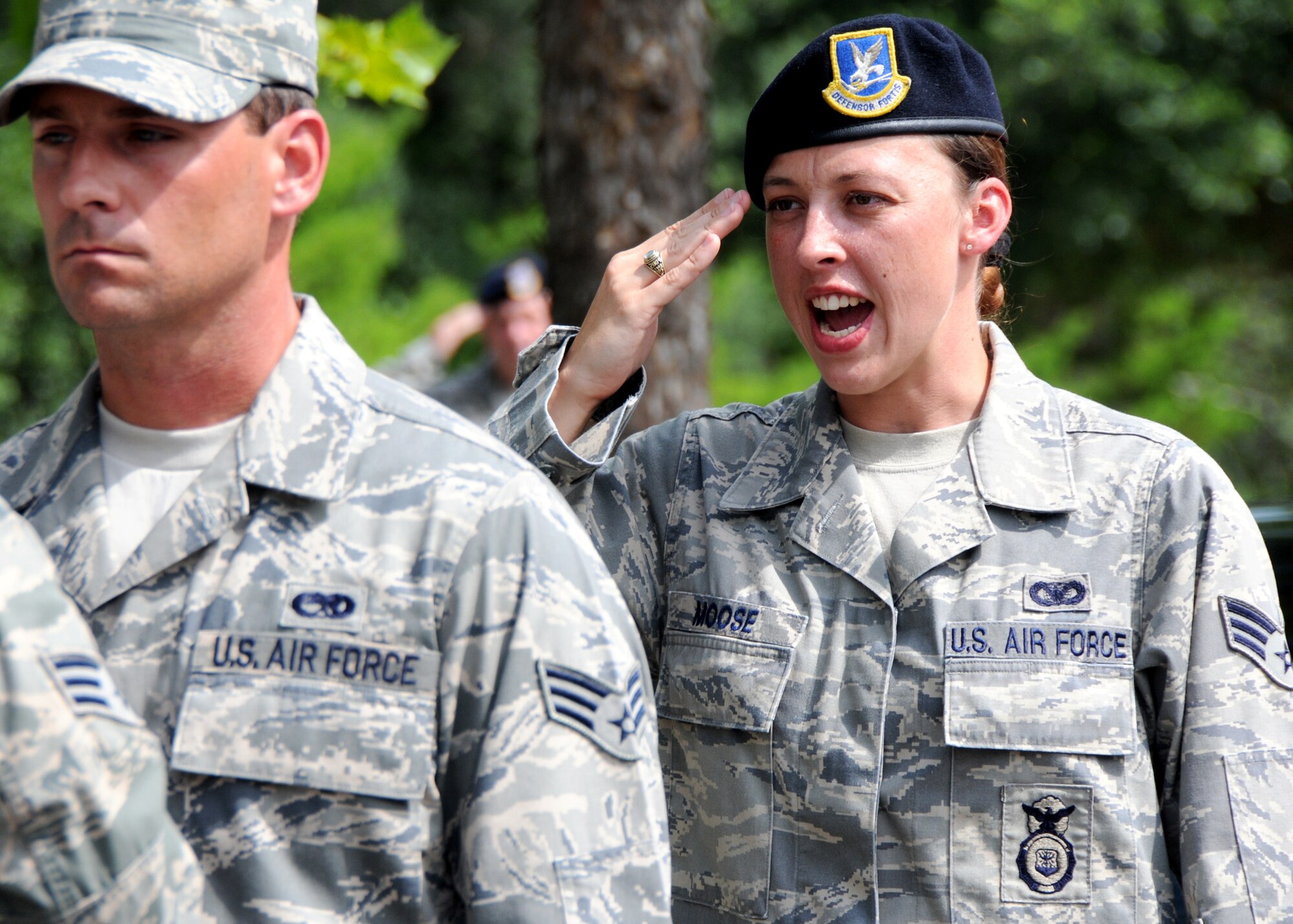 Senior Airman Delania Moose, 919th Security Forces Squadron, gives the call to “order arms” during a flag-raising ceremony July 11 at Duke Field. (U.S. Air Force photo/Tech. Sgt. Samuel King Jr.)