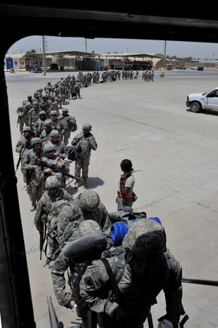 Members of Charlie Company, 67th Expeditionary Signal Battalion, out of Fort Gordon, Ga, board a C-17 Globemaster III from the 817th Expeditionary Airlift Squadron, Incirlik Air Base, Turkey, deployed from Charleston Air Force Base, S.C.  July 10, 2010, at Sather AB, Iraq. Charlie Co. is redeploying to their home unit as part of the drawdown to 50,000 troops in Iraq by August 31, 2010. (U.S. Air Force photo by Senior Airman Perry Aston) (Released)