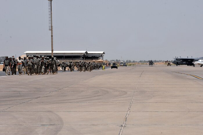 Members of Charlie Company, 67th Expeditionary Signal Battalion, out of Fort Gordon, Ga, board a C-17 Globemaster III from the 817th Expeditionary Airlift Squadron, Incirlik Air Base, Turkey, deployed from Charleston Air Force Base, S.C. July 10, 2010 at Sather AB, Iraq. Charlie Co. provided tactical communications within Iraq during their 12 month deployment. (U.S. Air Force photo by Senior Airman Perry Aston) (Released)