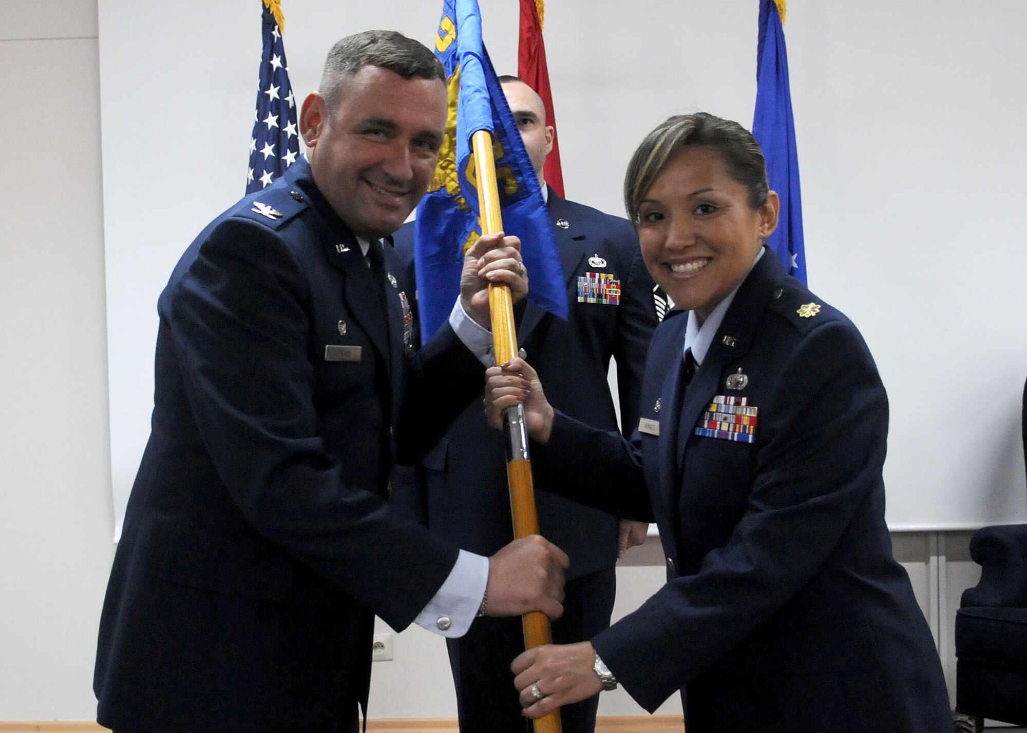 Maj. Kim Arnold (right) accepts command of the 39th Contracting Squadron from Col. Andrew Pears, 39th Mission Support Group commander, during the change of command ceremony July 12, 2010 at Incirlik Air Base, Turkey.  Major Arnold comes to the 39th CONS from the Contracting Division, Installations and Mission Support Directorate, Headquarters United States Air Forces in Europe.  The change of command ceremony is an Air Force tradition that gives unit Airmen the opportunity to view their new leader take command.  (U.S. Air Force photo/Senior Airman Ashley Wood)