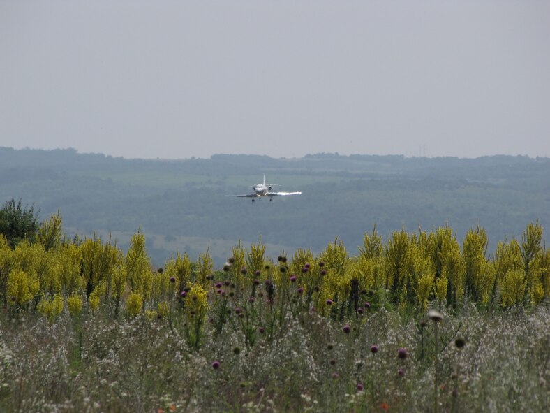 A Bulgarian aircraft approaches the runway at Dolna Mitropolia Airbase in June.  There, an Electronic Systems Center and contractor team completed a Foreign Military Sales case that provided a Tactical Air Navigation System to the NATO-member nation.  (Courtesy Photo)