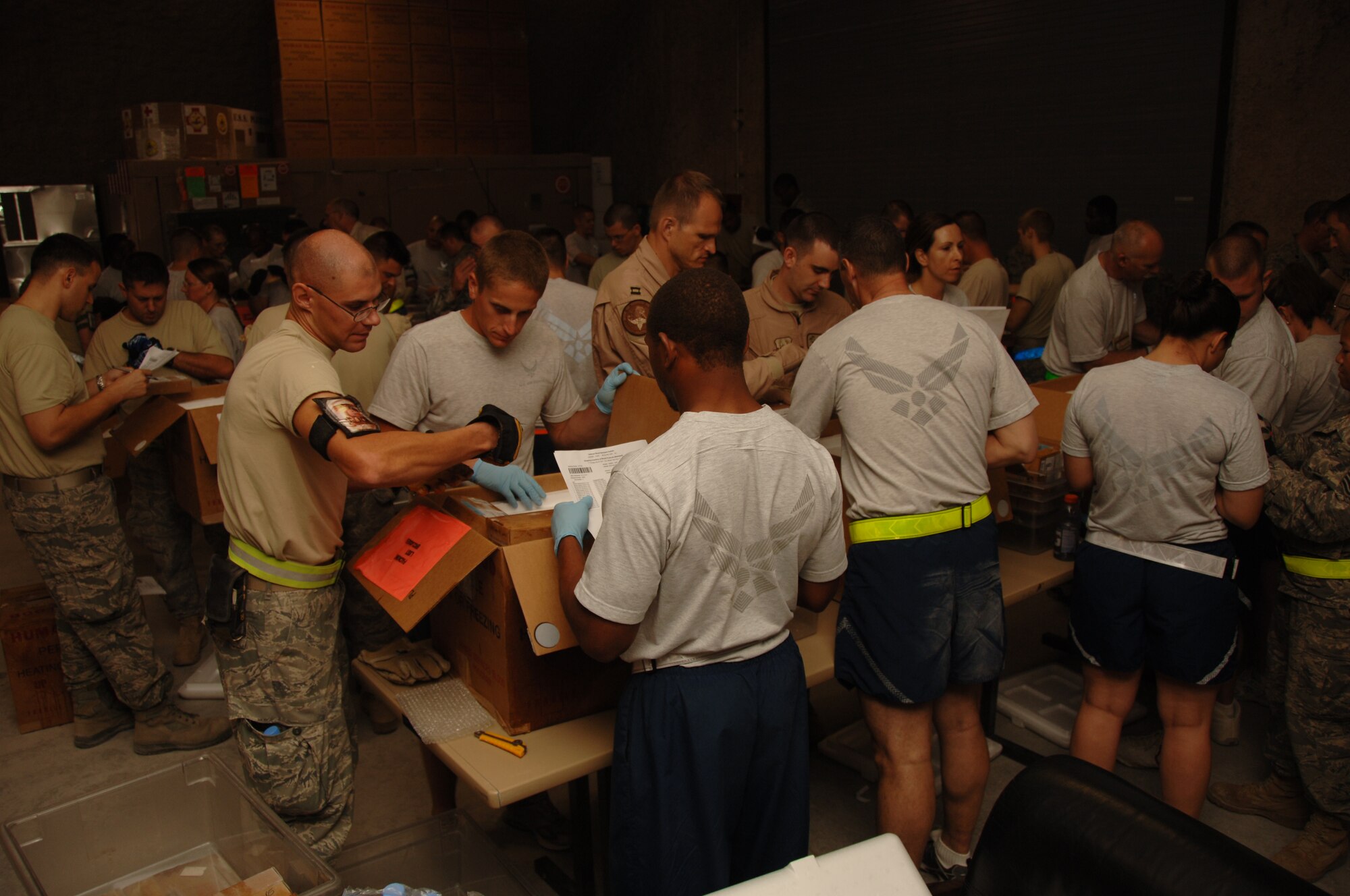 SOUTH WEST ASIA -- Volunteers verify blood products at the 379th Expeditionary Medical Group Blood Transhipment Center at an undisclosed location in Southwest Asia July 10. The center distributes blood products used in theater.  (U.S. Air Force Photo by Tech. Sgt. Kimberly Spinner)