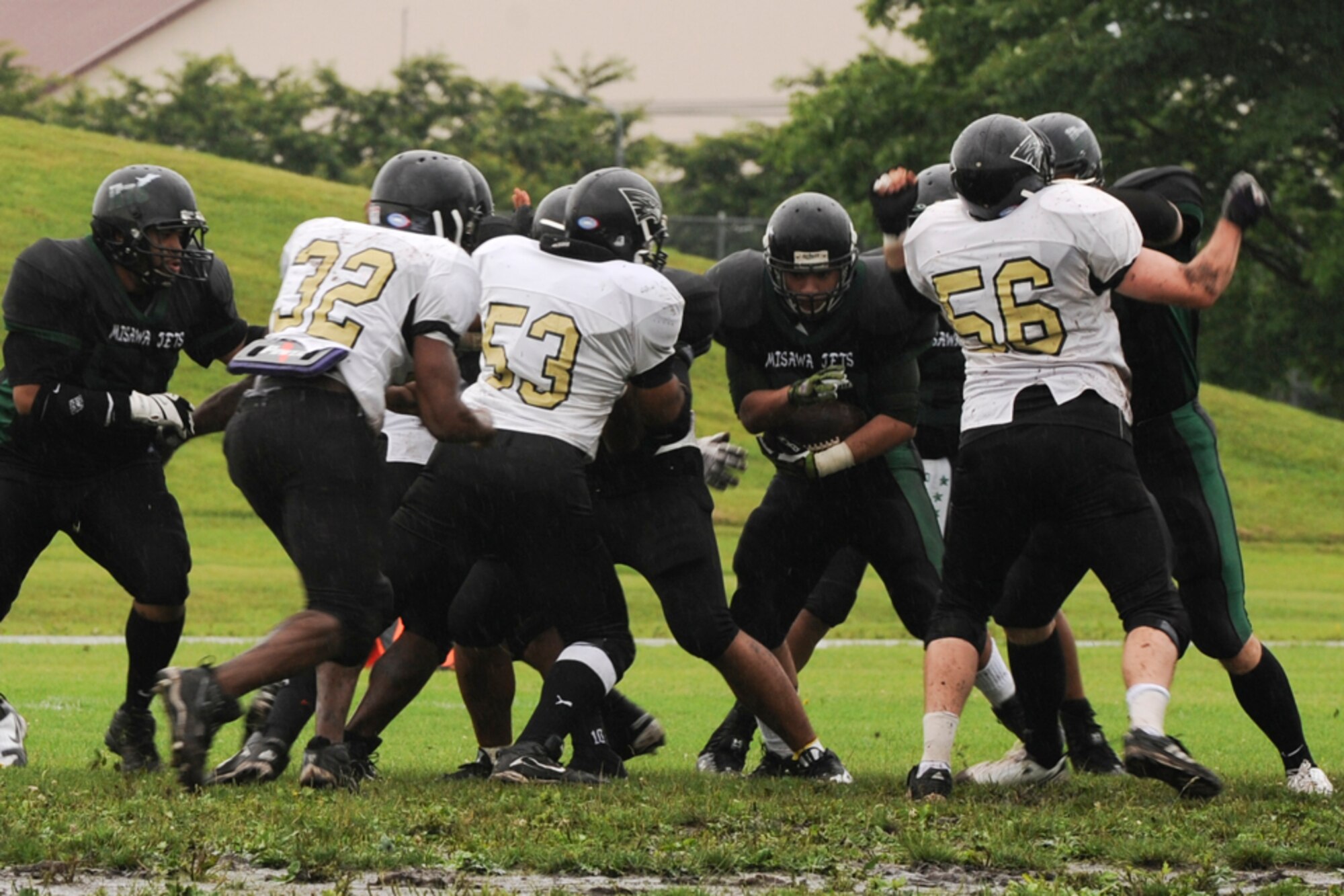 MISAWA AIR BASE, Japan – The Misawa Jets varsity football team battles it out with the Yokosuka Seahawks July 10 at the Hillside Stadium. The Jets beat the Seahawks 36 - 8 at the U.S. Forces Japan-American Football League North Division playoff opener. (U.S. Air Force photo/Tech. Sgt. Russell J. McBride) 