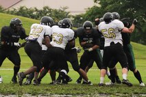 MISAWA AIR BASE, Japan – The Misawa Jets varsity football team battles it out with the Yokosuka Seahawks July 10 at the Hillside Stadium. The Jets beat the Seahawks 36 - 8 at the U.S. Forces Japan-American Football League North Division playoff opener. (U.S. Air Force photo/Tech. Sgt. Russell J. McBride) 