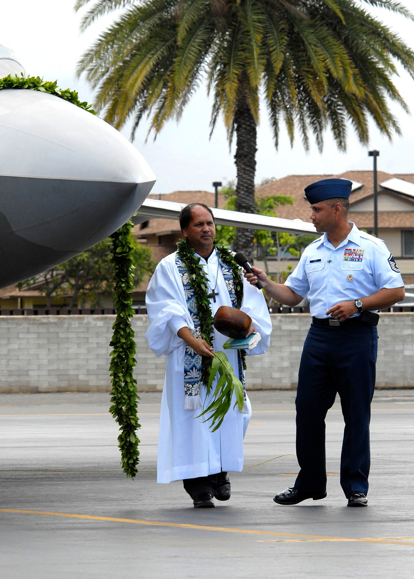 Kahu Kordell Kekoa blesses an F-22 Raptor with ti leaves and Hawaiian water during the F-22 Raptor Arrival Ceremony at Joint Base Pearl Harbor-Hickam, Hawaii, July 9, 2010. The arrival of the F-22 Raptor marks the beginning of a new associate unit between the Hawaii Air National Guard and the active duty Air Force. The Raptor represents an exponential leap in warfighting capabilities for U.S. forces in the Pacific. (U.S. Air Force photo/Tech Sgt. Jerome S. Tayborn)