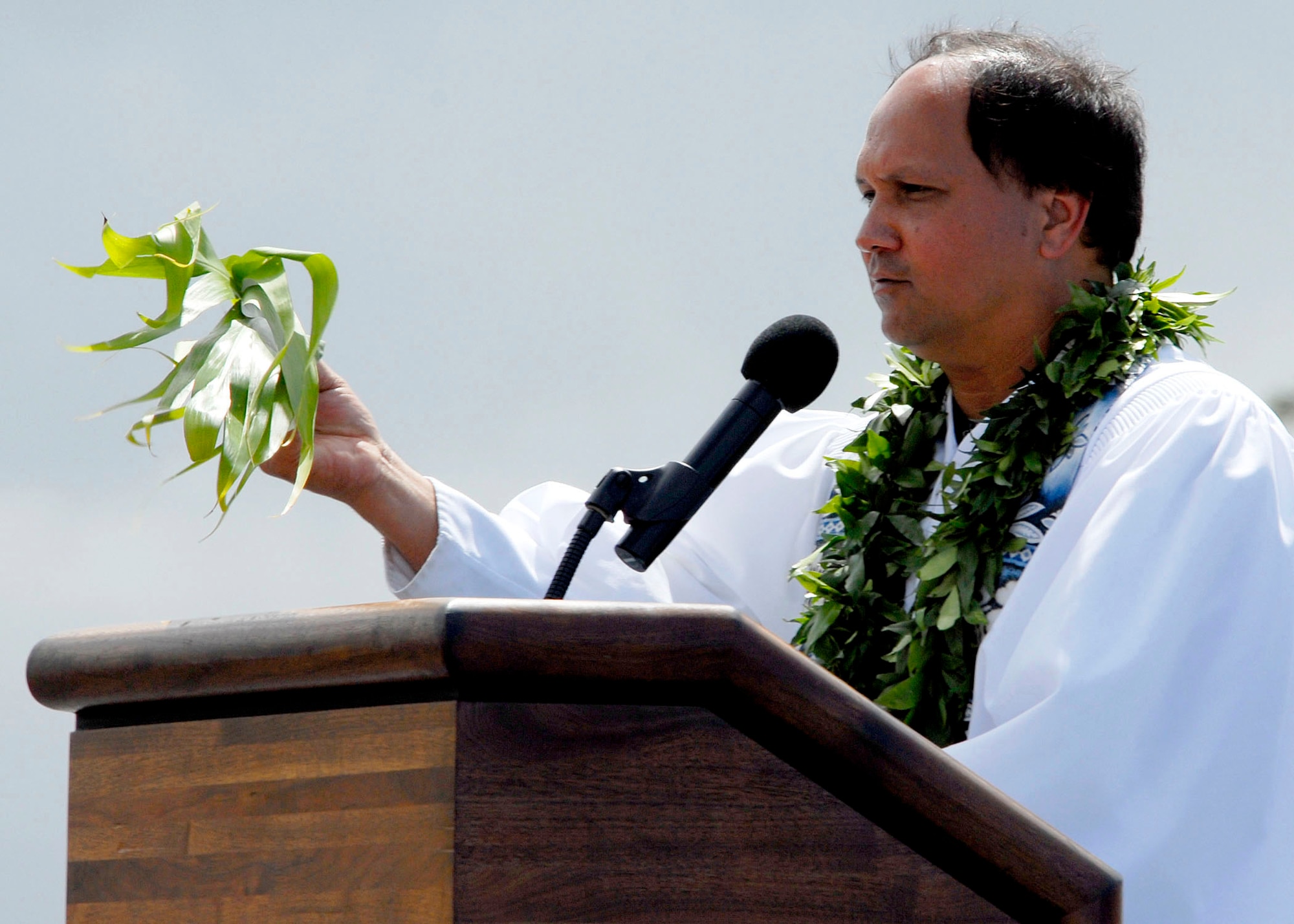 Kahu Kordell Kekoa explains the Hawaiian traditional blessing he will be performing on the F-22 Raptors with ti leaves and Hawaiian water during the F-22 Raptor Arrival Ceremony at Joint Base Pearl Harbor-Hickam, Hawaii, July 9, 2010. The arrival of the F-22 Raptor marks the beginning of a new associate unit between the Hawaii Air National Guard and the active duty Air Force. The Raptor represents an exponential leap in warfighting capabilities for U.S. forces in the Pacific. (U.S. Air Force photo/Tech Sgt. Jerome S. Tayborn)