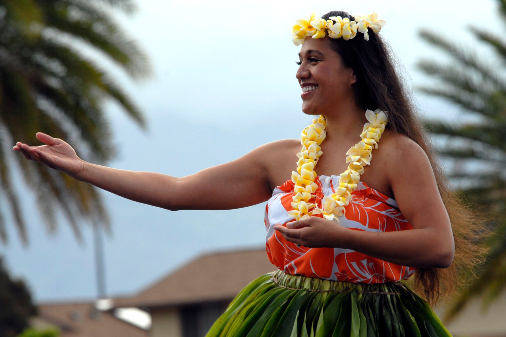 A Hawaiian dancer, welcomes the arrival of the first two F-22 Raptors Joint Base Pearl Harbor-Hickam, Hawaii, July 9, 2010. The F-22 Raptor is the Air Force's newest fighter aircraft. Its combination of stealth, supercruise, maneuverability, and integrated avionics, coupled with improved supportability, represents an exponential leap in warfighting capabilities. The ceremony marks the beginning of the partnership between the Hawaii Air National Guard and the active duty Air Force flying the fifth generation fighter at Hickam. The F-22 Raptors are assigned to the 199th Fighter Squadron,154th Wing, Hawaii Air National Guard and the 19th Fighter Squadron, 15th Wing. The Raptor represents an exponential leap in warfighting capabilities for U.S. forces in the Pacific.  (U.S. Air Force photo/ Tech Sgt. Jerome S. Tayborn)