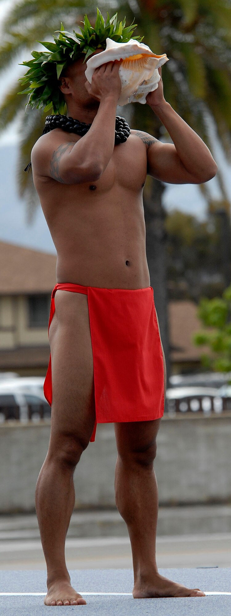A Hawaiian conch shell blower,  blowing the 'Pu' (pronounced 'poo'), which is the Hawaiian name for conch shell, marks these days very often the official beginning of a ceremony. Traditionally, blowing of the Pu, is a deep part of the Hawaiian culture, has various meanings. Today the "Pu" is used to announce the opening of the ceremony for the arrival of Joint Base Pearl Harbor-Hickam, Hawaii, arrival of its first F-22 Raptors.  The Raptor represents an exponential leap in warfighting capabilities for U.S. forces in the Pacific. (U.S. Air Force photo/ Tech Sgt. Jerome S. Tayborn)
