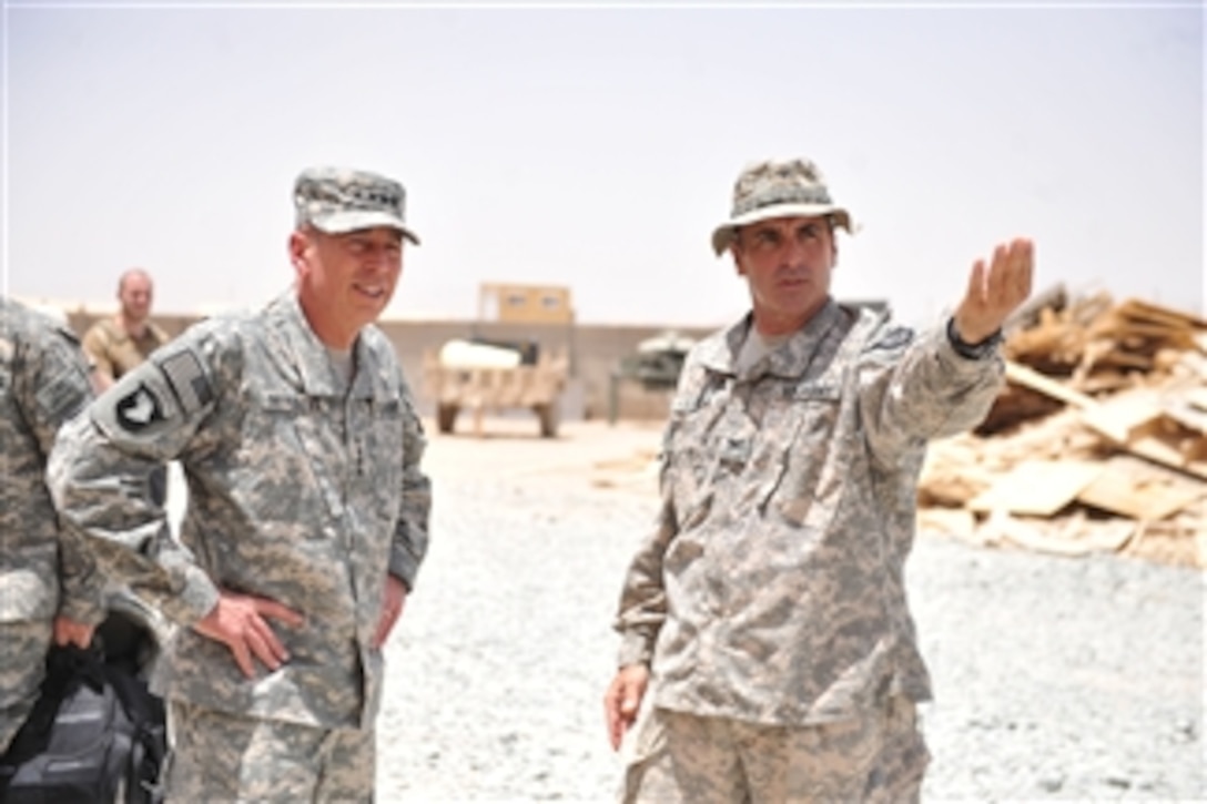 U.S. Army Col. Arthur Kandarian (right) briefs Gen. David H. Petraeus in Kandahar, Afghanistan, on July 9, 2010.  Petraeus is commander of the International Security Assistance Force and U.S. Forces Afghanistan and Kandarian is commander of 2nd Battalion, 502nd Infantry Regiment, 101st Airborne Division.  