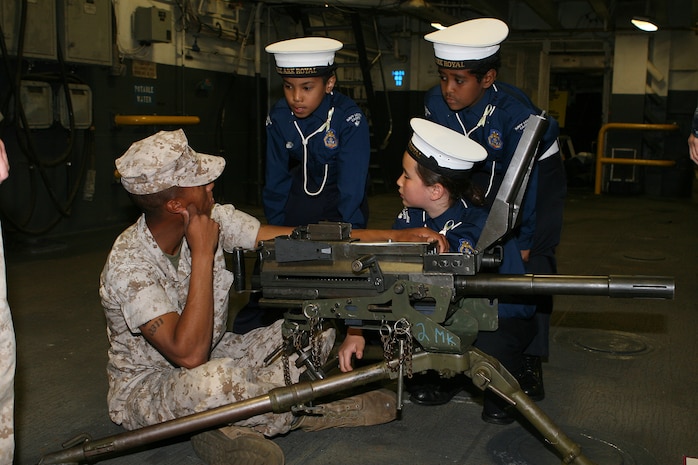 Corporal Garcia describes the Mk-19 grenade launcher to Canadian Sea Cadets during the Canadian Naval Centennial. The Marines participated in static displays, receptions and parades to celebrate 100 years of service of the Canadian Navy.