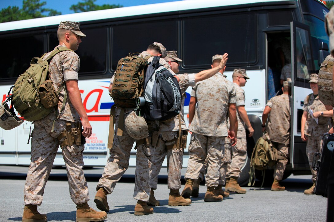 U.S. Marines and Sailors with Special-Purpose Marine Air-Ground Task Force Continuing Promise 2010, board a bus after saying goodbye to family and friends for four months at Marine Corps Air Station Cherry Point, N.C., July 13. Marines and Sailors are deploying in support of Operation Continuing Promise 2010 to provide humanitarian assistance and disaster relief to Caribbean, Central and South America.