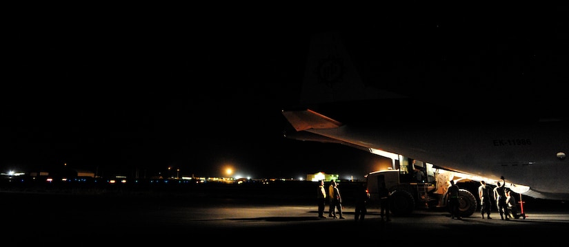 CAMP MARMAL, MAZAR-I-SHARIF, Afghanistan – An Antonov AN-21 is unloaded by members of the 621st Contingency Response Wing at Camp Marmal, Afghanistan July 2. The Joint-Base McGuire-Dix-Lakehurst, NJ, mobility Airmen often download cargo from international aircraft in its worldwide mission to provide short notice or high demand aerial port capability to austere or storm-damaged locations. (U.S. Air Force photo/Tech. Sgt. Parker Gyokeres/released)