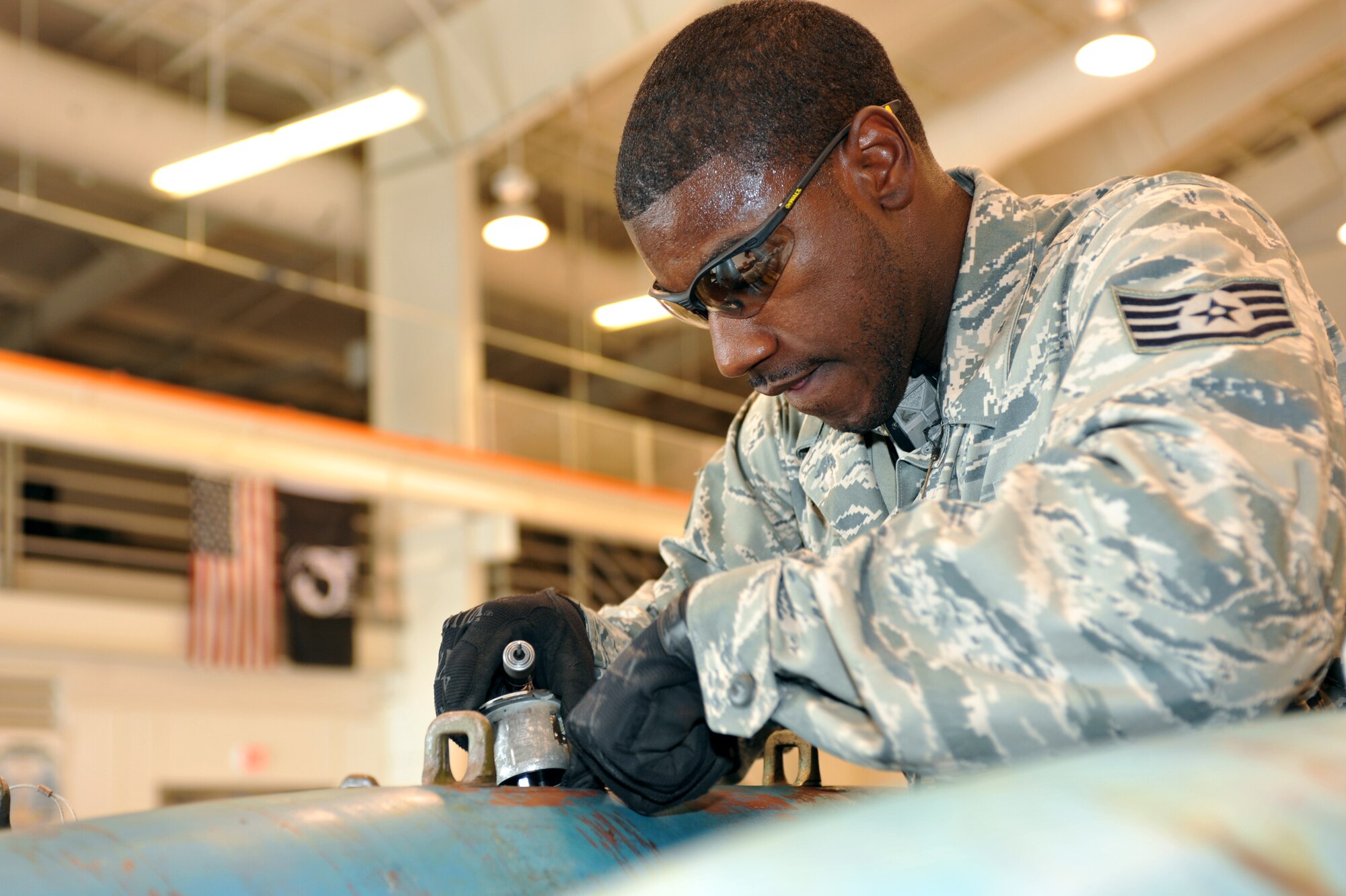 WHITEMAN AFB, Mo. - Staff Sgt. Tyler Campbell, 509th Munitions Squadron, installs an arming device into a 500-pound MK-82 bomb, during a practice session for the Air Force Global Strike Command Challenge, Jul. 12. Sergeant Campbell was assigned to install the arming devices on each of the 12 bombs assembled during the practice session. 