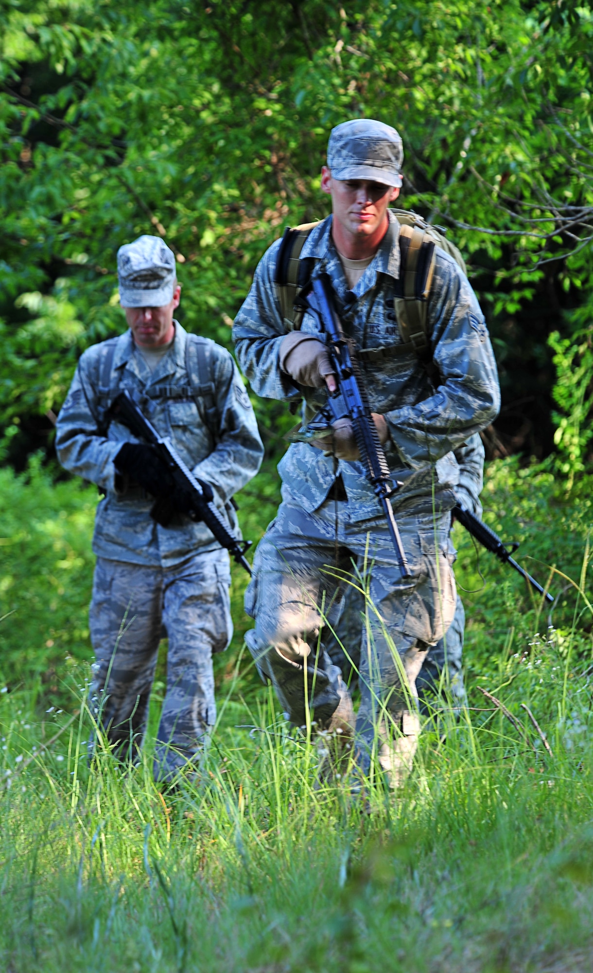 100708-F-8430J-157
SHAW AIR FORCE, S.C. - Senior Airman Samuel Brown, 682nd Air Support Operations Squadron C4 systems technician, (right) and Staff Sgt. Michael Barnwell, 682nd Air Support Operations Squadron ground radio technician, navigates through the woods during a tactical air control party exercise, July 7, 2010. Airman Brown and Sergeant Barnwell participated in the exercise to renew their currencies. The TACP members are specialists who are assigned to combat units. They advise ground forces on aircraft employment and capabilities, coordinate and control aerospace operation and participate in battle planning. (U.S. Air Force photo/Airman 1st Class Amber E. N. Jacobs)