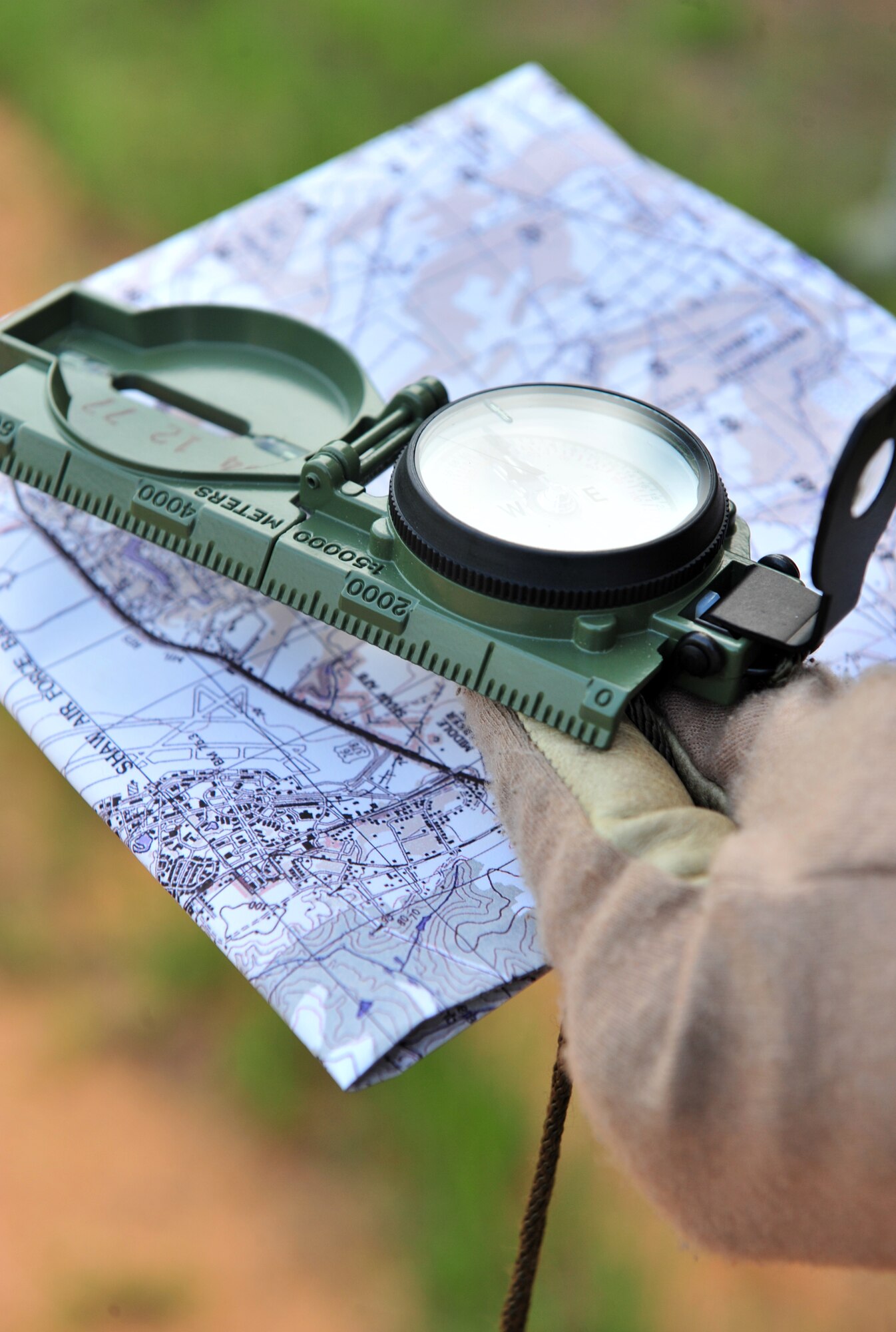 100708-F-8430J-087
SHAW AIR FORCE, S.C. - A compass and map used during the land navigation portion of a tactical air control party exercise by members of the 682nd Air Support Operations Squadron, July 7, 2010. In order to renew TACP currencies, Airmen are tasked with six different evaluations one of which is land navigation with a compass and map. The TACP are the specialists who are assigned to combat units. They advise ground forces on aircraft employment and capabilities, coordinate and control aerospace operation and participate in battle planning. (U.S. Air Force photo/Airman 1st Class Amber E. N. Jacobs)