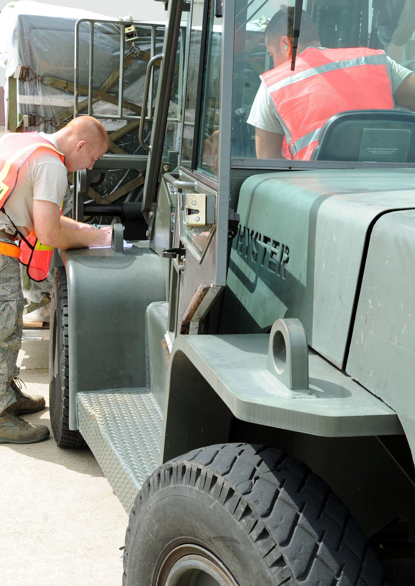 LANGLEY AIR FORCE BASE, Va. – Tech. Sgt. Troy Hosmer, 633d Logistics Readiness Squadron ramp coordinator, verifies pallet identifiers during a Cargo Deployment Function war day July 13.  The exercise is in preparation for the upcoming ORE.  (U.S. Air Force photo/Staff Sergeant Tabitha Kuykendall)