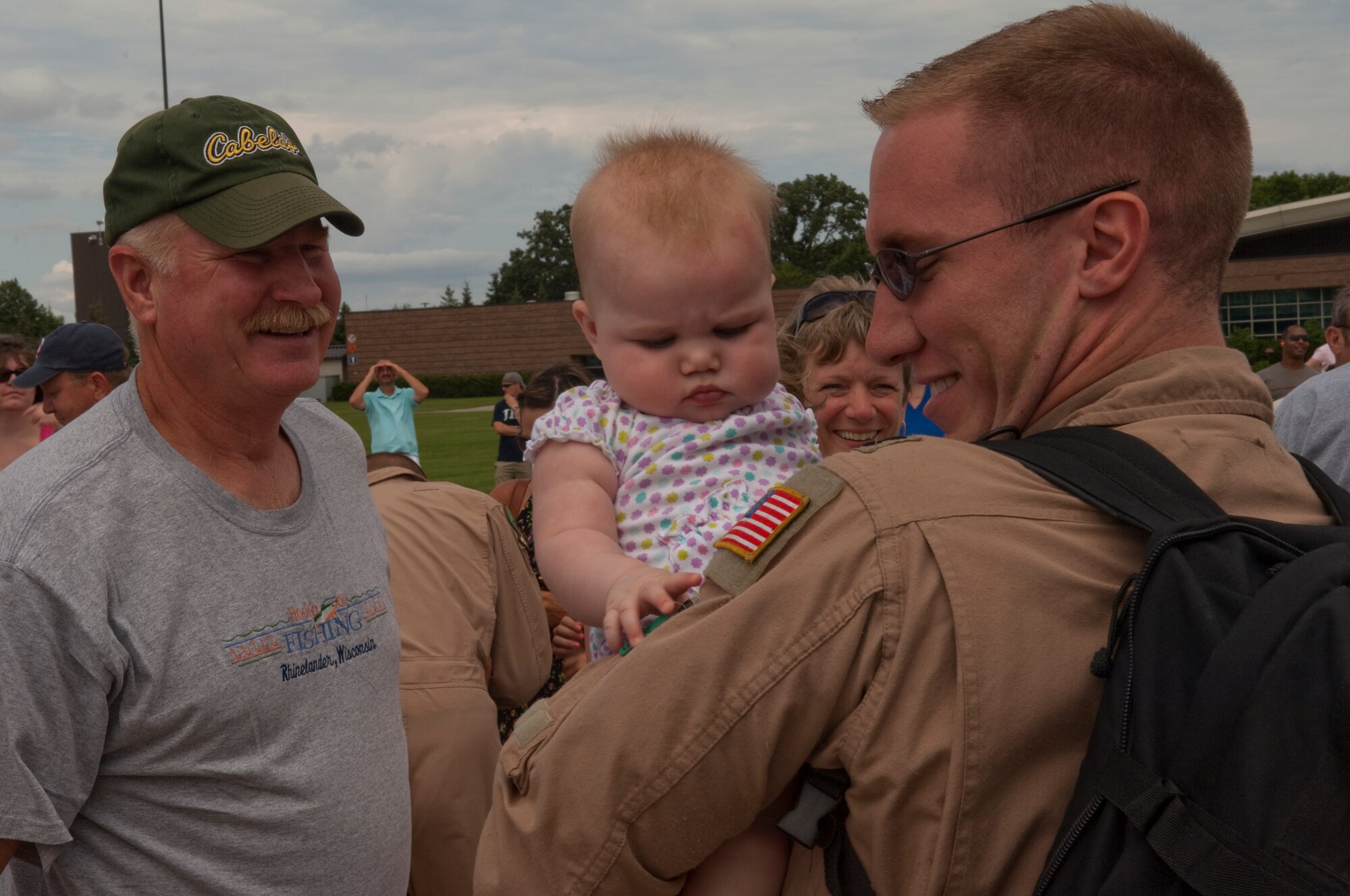 Friends and family excitedly greet Airmen disembarking from a C-130 "Hercules" at the Minneapolis-St. Paul International airport on July 11, 2010. The military cargo aircraft and about twenty Airmen are the first in a series of returns from Afghanistan during July for the 133rd Airlift Wing in 2010. USAF official photo by Senior Master Sgt. Mark Moss