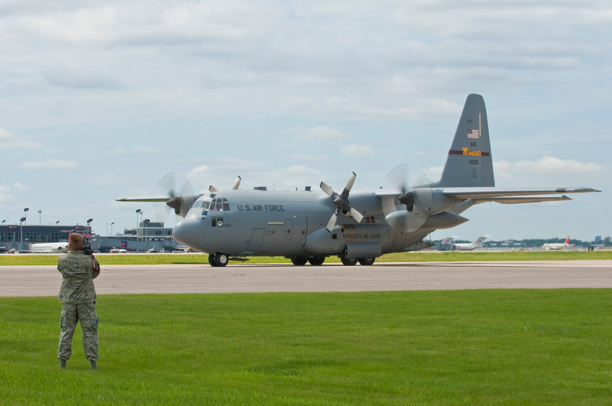 A  C-130 "Hercules" taxis into position for recovery at the Minneapolis-St. Paul International airport on July 11, 2010 after returning from a tour in Afghanistan. The military cargo aircraft and about twenty Airmen are the first in a series of returns during July for the 133rd Airlift Wing in 2010. USAF official photo by Senior Master Sgt. Mark Moss