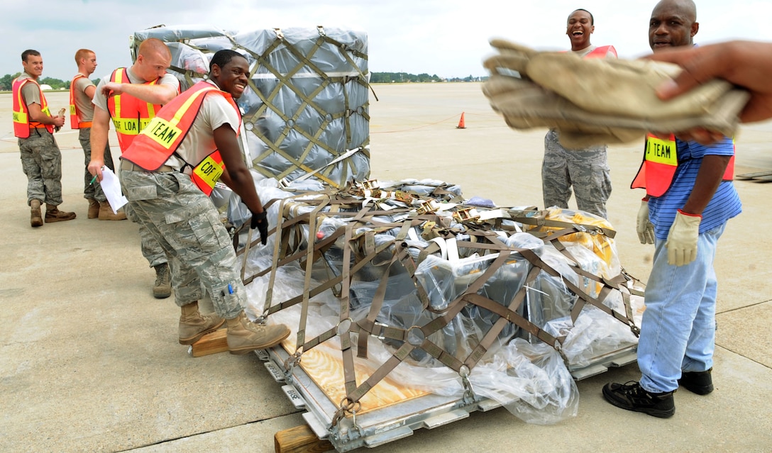 LANGLEY AIR FORCE BASE, Va. – The 633d Logistics Readiness Squadron marshalling and load team, builds a silhouette chalk to be loaded on an aircraft during a Cargo Deployment Function war day July 13.  The exercise is in preparation for the upcoming ORE.  (U.S. Air Force photo/Staff Sergeant Tabitha Kuykendall) 
