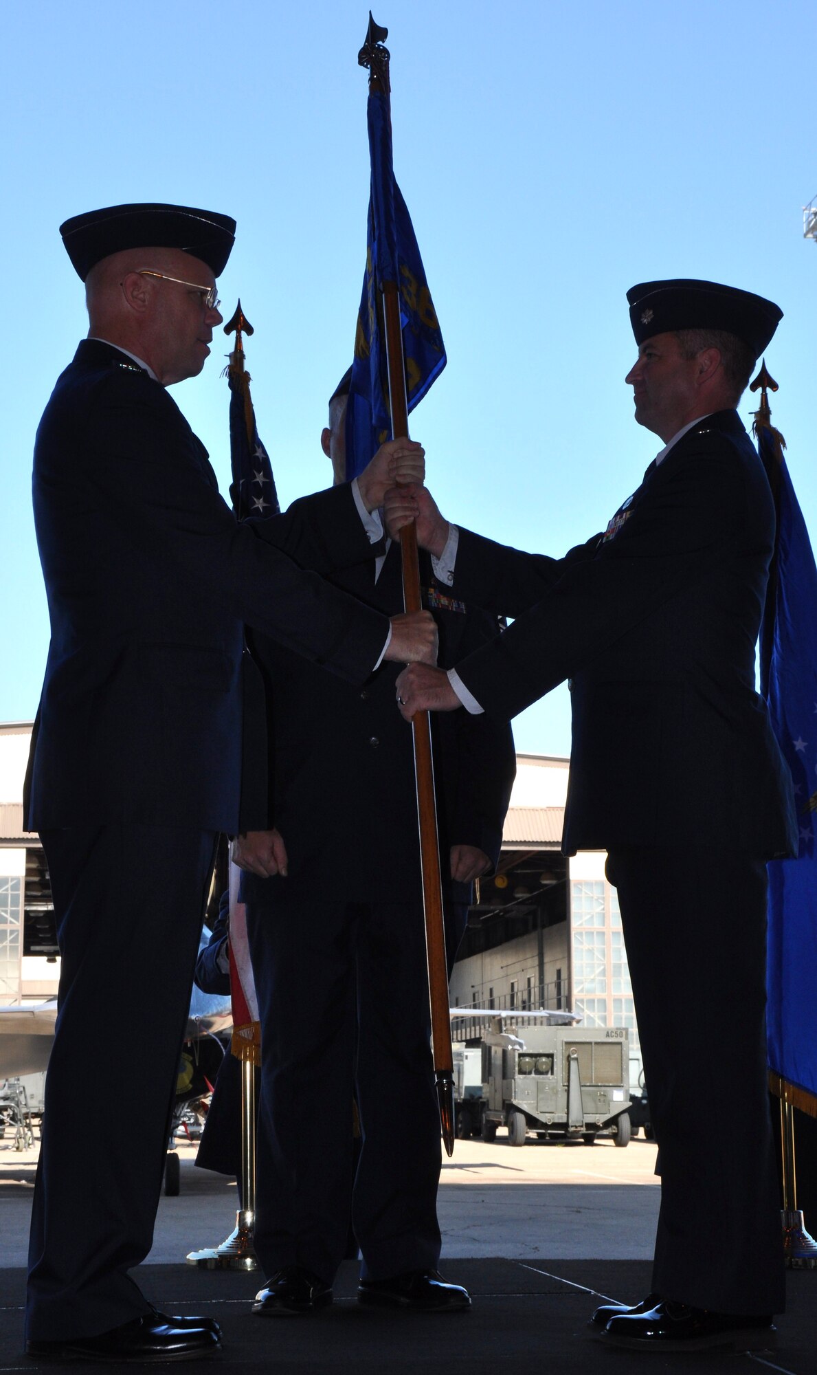 Lt. Col. Eric Jackson (right) takes command of the 365th Training Squadron from Col. Kenneth Backes (left), 782nd Training Group commander, during the change of command ceremony held in Hangar 1060 at Sheppard Air Force Base, Texas, July 13, 2010.  The 365th TRS develops and conducts technical and military training for more than 2,000 United States and international military and Department of Defense civilian students annually, supporting fighter and bomber avionics, optical and infrared reconnaissance and advanced target-designating systems.  (U.S. Air Force photo/Tech. Sgt. Vernon Cunningham)
