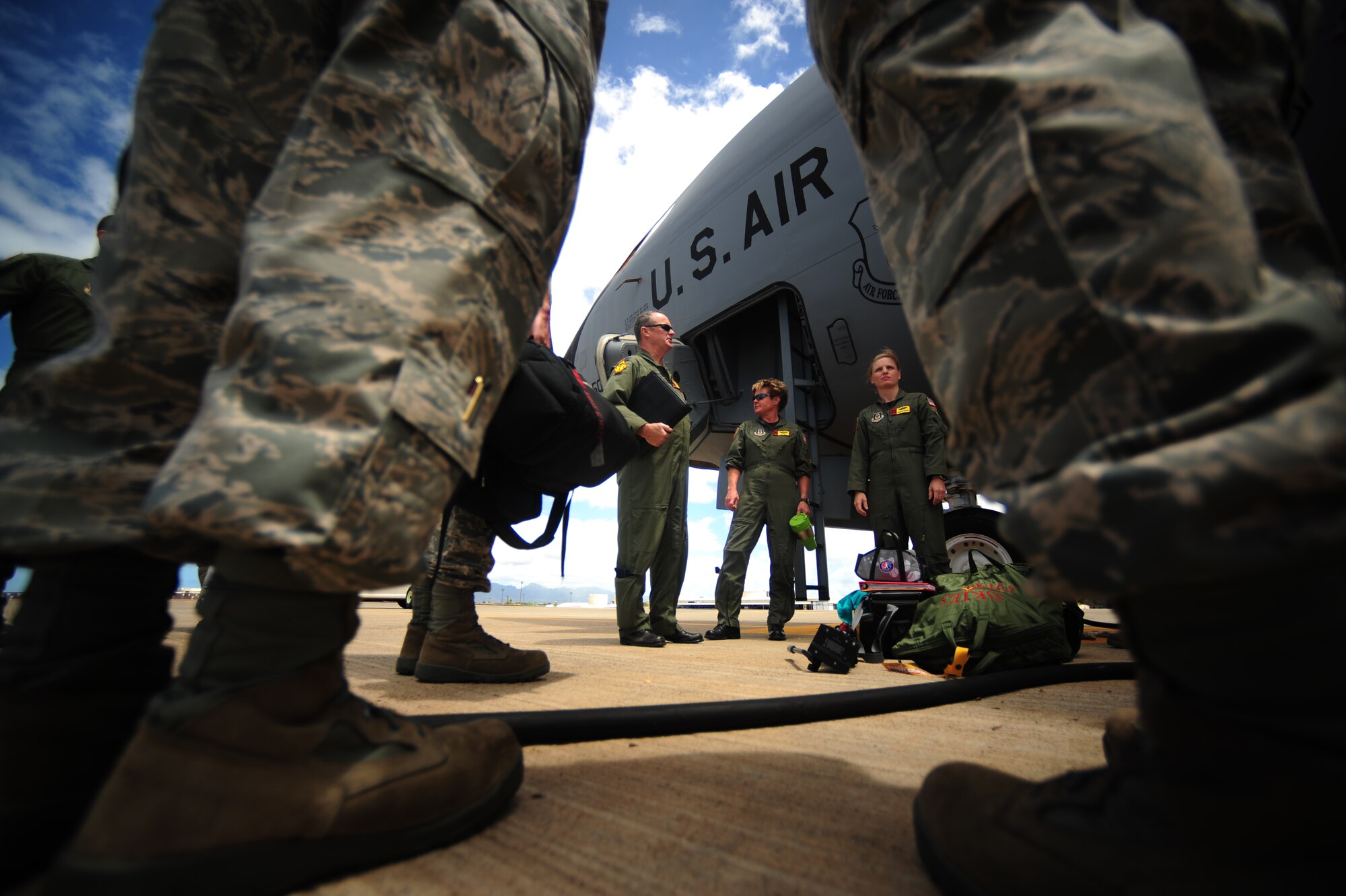 A U.S. Air Force KC-135 Stratotanker crew assigned to the 465th Air Refueling Squadron, Tinker Air Force Base, Okla., receive an aircraft maintenance status report prior to a refueling mission during exercise Rim of the Pacific (RIMPAC) at Joint Base Pearl Harbor Hickam, Hawaii, July 9, 2010.  RIMPAC 2010 is the 22nd in a series of significant international combined/joint military exercises scheduled biennially by U.S. Pacific Fleet and takes place in the Hawaiian operating area.  RIMPAC training operations include participation by more than 14 nations, 34 ships, five submarines, more than 100 aircraft, and more than 20,000 Soldiers, Sailors, Marines and Airmen.  Multilateral exercises such as RIMPAC enhance cooperation between partnering nations and provide a unique opportunity to practice the ability to plan, communicate, and execute operations.  (U.S. Air Force photo by Tech. Sgt. Jacob N. Bailey/Released)



