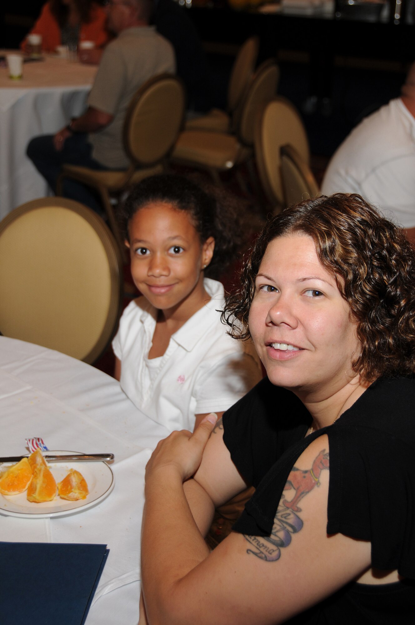 U.S. Air Force Master Sgt. Tara Brown of 175th Logistics Readiness Squadron, Maryland Air National Guard, and her daughter Kayla have breakfast before attending the many classes being held at the first 30-day post-deployment Yellow Ribbon Reintegration Program hosted by the Maryland Air National Guard at the Sheraton Baltimore City Center Hotel on July 9-10. (U.S. Air Force photo by Master Sgt. Ed Bard/Released) 
