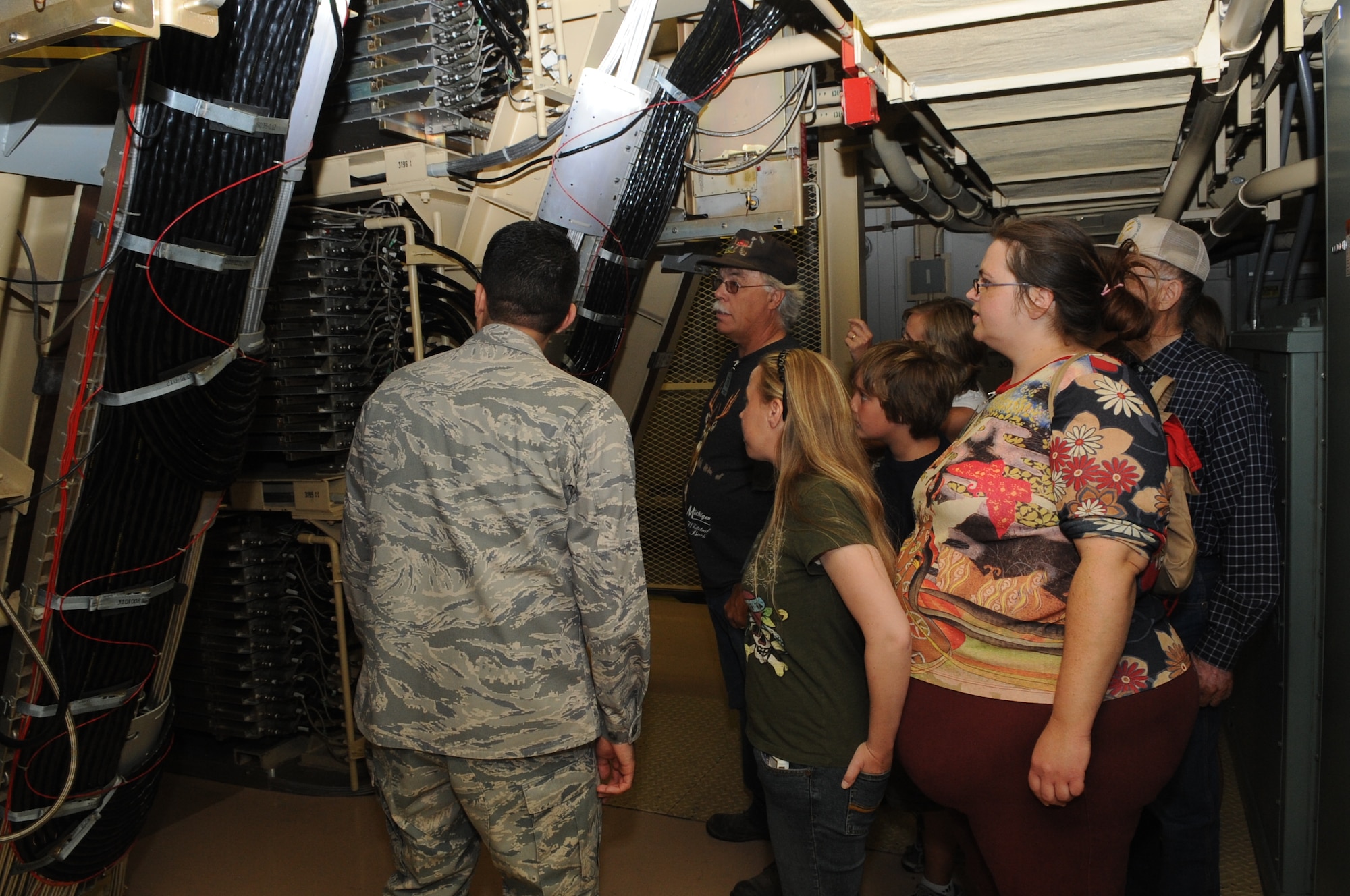 A tour group is briefed on the capabilities of the Phased Array Radar by 2nd Lt. Francisco Vazquez, 10th Space Warning Squadron, at an open house July 10 at Cavalier Air Force Station. This Radar is capable of detecting sea launched ballistic missiles and intercontinental ballistic missiles over the United States and Canada. The open was held as a way for people within the local community to learn about the mission and capabilities of Cavalier AFS as well as the Air Force and military in general. (U.S. Air Force photo by 1st Lt. Anastasia Wasem) 