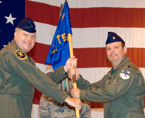 Lt. Col. Dwain Kuehl, right, accepts command of the 5th Flying Training Squadron at Vance AFB, from Col. Terry Ross, the 340th Flying Training Group commander, during a ceremony held July 9 in Hangar 170. Colonel Kuehl replaced Lt. Col. Paul Tom, who has been at Vance since 1997. Colonel Tom is retiring from the Air Force Reserve and will remain in the Enid area. (U.S. Air Force photo/ Terry Wasson)