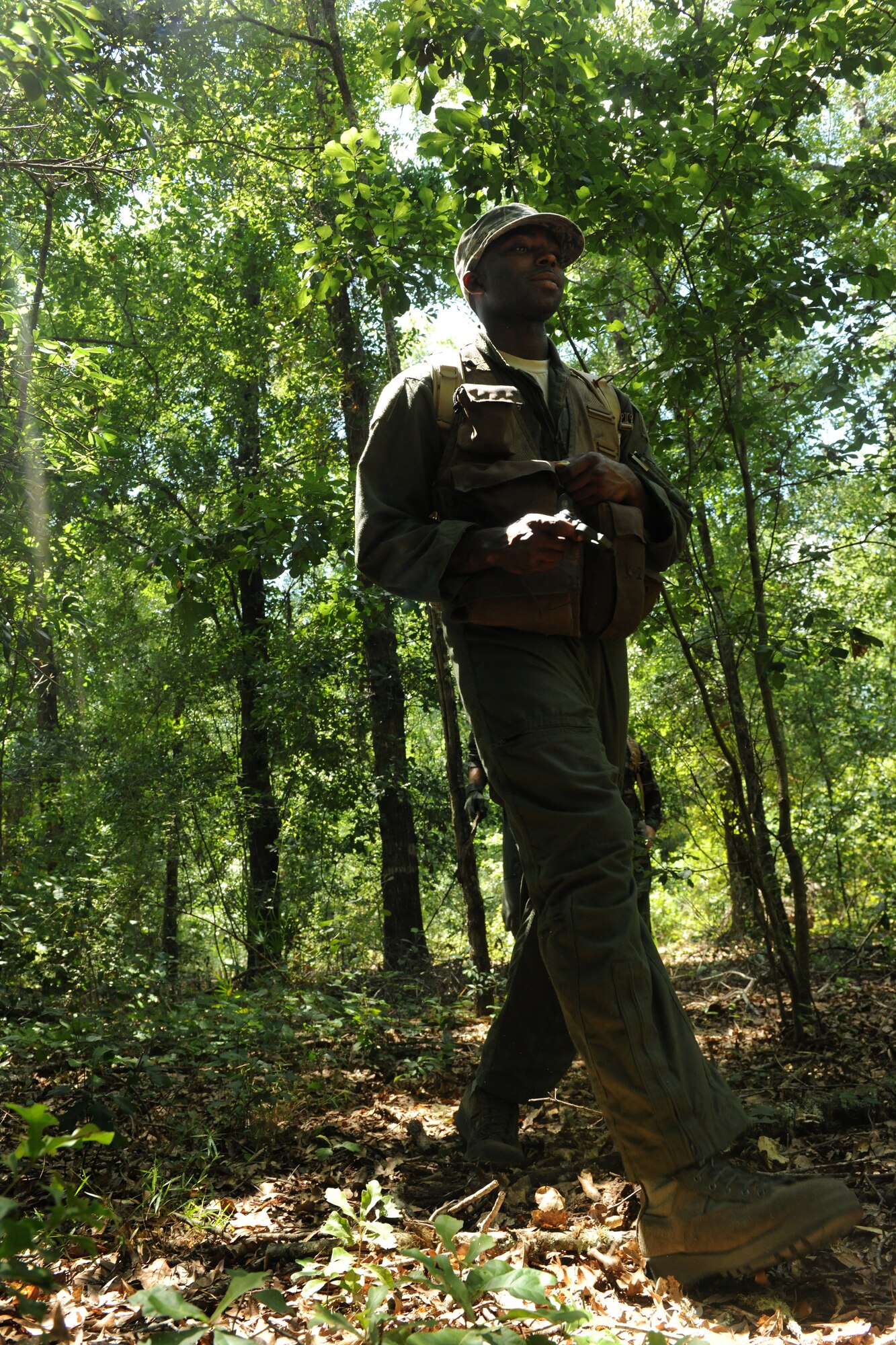 MOODY AIR FORCE BASE, Ga. -- Senior Airman Dangelo Dairon, 71st Rescue Squadron mission systems specialist, travels with his group during survival, evasion, resistance and escape training here July 6. The SERE instructors taught the class different evasion techniques during the training. (U.S. Ai r Force photo by Airman 1st Class Benjamin Wiseman/RELEASED)