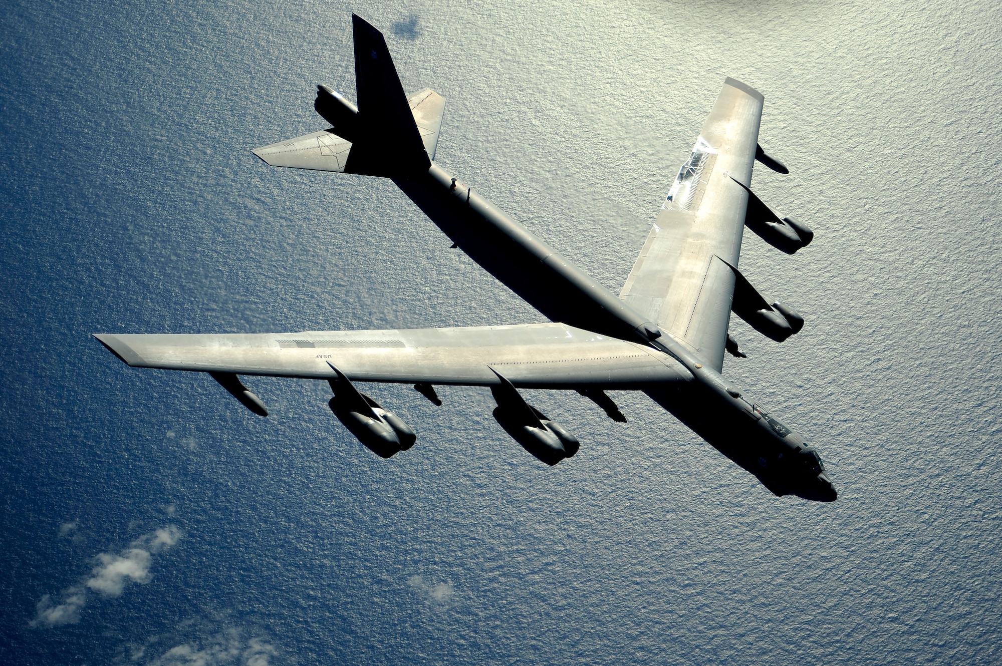 A B-52 Stratofortress flies over the Pacific Ocean after an air refueling in support of exercise Rim of the Pacific, July 10, 2010.  RIMPAC is a biennial, multinational exercise designed to strengthen regional partnerships and improve interoperability.  The B-52 is from the 20th Bomb Squadron at Barksdale Air Force Base, La.  (U.S. Air Force photo/Staff Sgt. Kamaile O. Long)