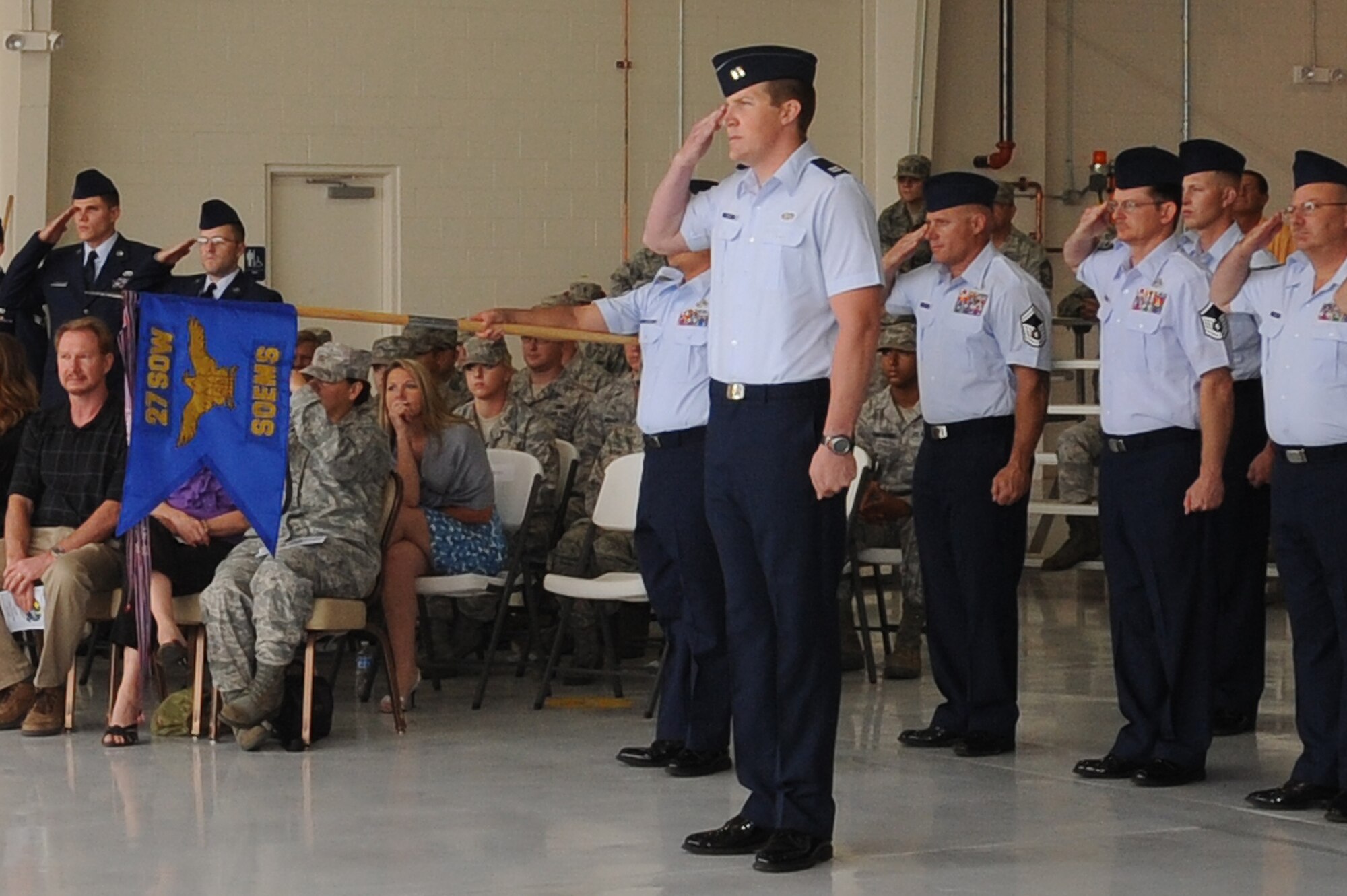 Members of the 27th Special Operations Equipment Maintenance Squadron salute their incomming commander, U.S. Air Force Maj. John Baquet during a change of command ceremony at Cannon AFB, N.M., 8 July 2010.  The change of command ceremony is a time-honored tradition that allows the unit to witness the old commanders relinquish their position and for new commanders to assume their roles over the squadron. (U.S. Air Force photo by Airman First Class Maynelinne De La Cruz)(Released)