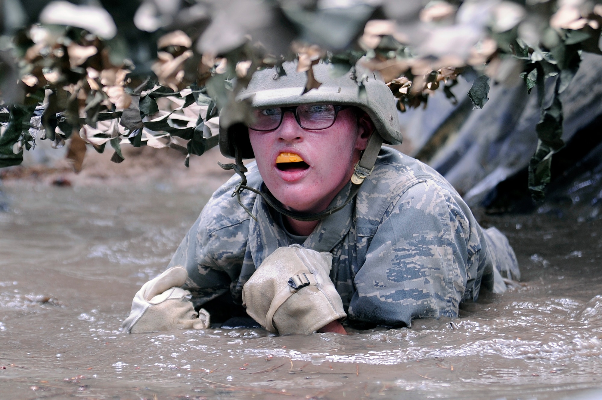 Basic Cadet Elizabeth Hicks navigates the assault course in Jacks Valley July 12, 2010. Basic cadets spend about two weeks in Jacks Valley learning how to work as a team to conduct military operations. (U.S. Air Force photo/Mike Kaplan)