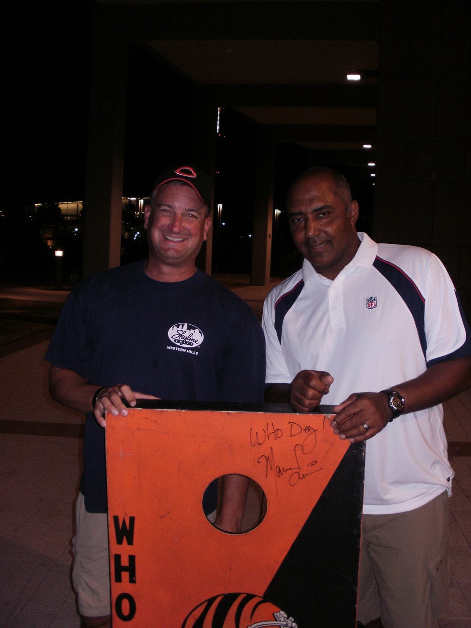WRIGHT-PATTERSON AIR FORCE BASE, Ohio – Master Sgt. Jon Winters, 89th Airlift Squadron, and fellow crewmembers had the opportunity to play a game of cornhole with Cincinnati Bengals coach Marvin Lewis during some downtime at Ramstein Air Base, Germany. Four NFL coaches participating in the NFL-USO Coaches tour at the end of June met with military members serving overseas. (U.S. Air Force photo/Master Sgt. Chuck Fritz)