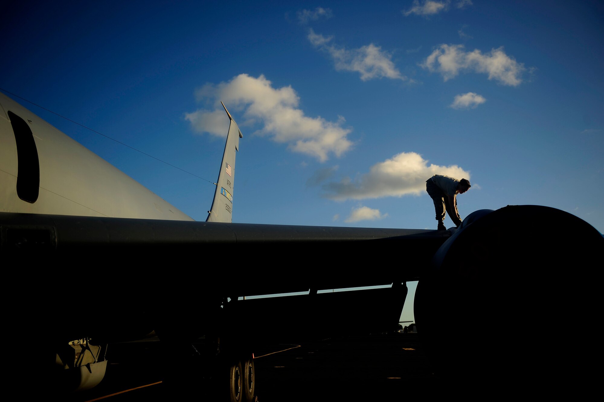 U.S. Air Force Staff Sgt. Dawn Coleman of Rush Springs, Okla., conducts a maintenance check on a KC-135 Stratotanker at Hickam Air Force Base, Hawaii, on July 8, 2010.  Sgt. Coleman is a crew chief assigned to the 507th Aircraft Maintenance Squadron, Tinker Air Force Base, Okla., one of the many units supporting exercise Rim of the Pacific (RIMPAC).   RIMPAC 2010 is the 22nd in a series of significant international combined/joint military exercises scheduled biennially by U.S. Pacific Fleet and takes place in the Hawaiian operating area.  RIMPAC training operations include participation by more than 14 nations, 34 ships, five submarines, more than 100 aircraft, and more than 20,000 Soldiers, Sailors, Marines and Airmen.  Multilateral exercises such as RIMPAC enhance cooperation between partnering nations and provides a unique opportunity to practice the abilities to plan, communicate, and execute operations.  (U.S. Air Force photo by Staff Sgt. Kamaile O. Long/Released)
