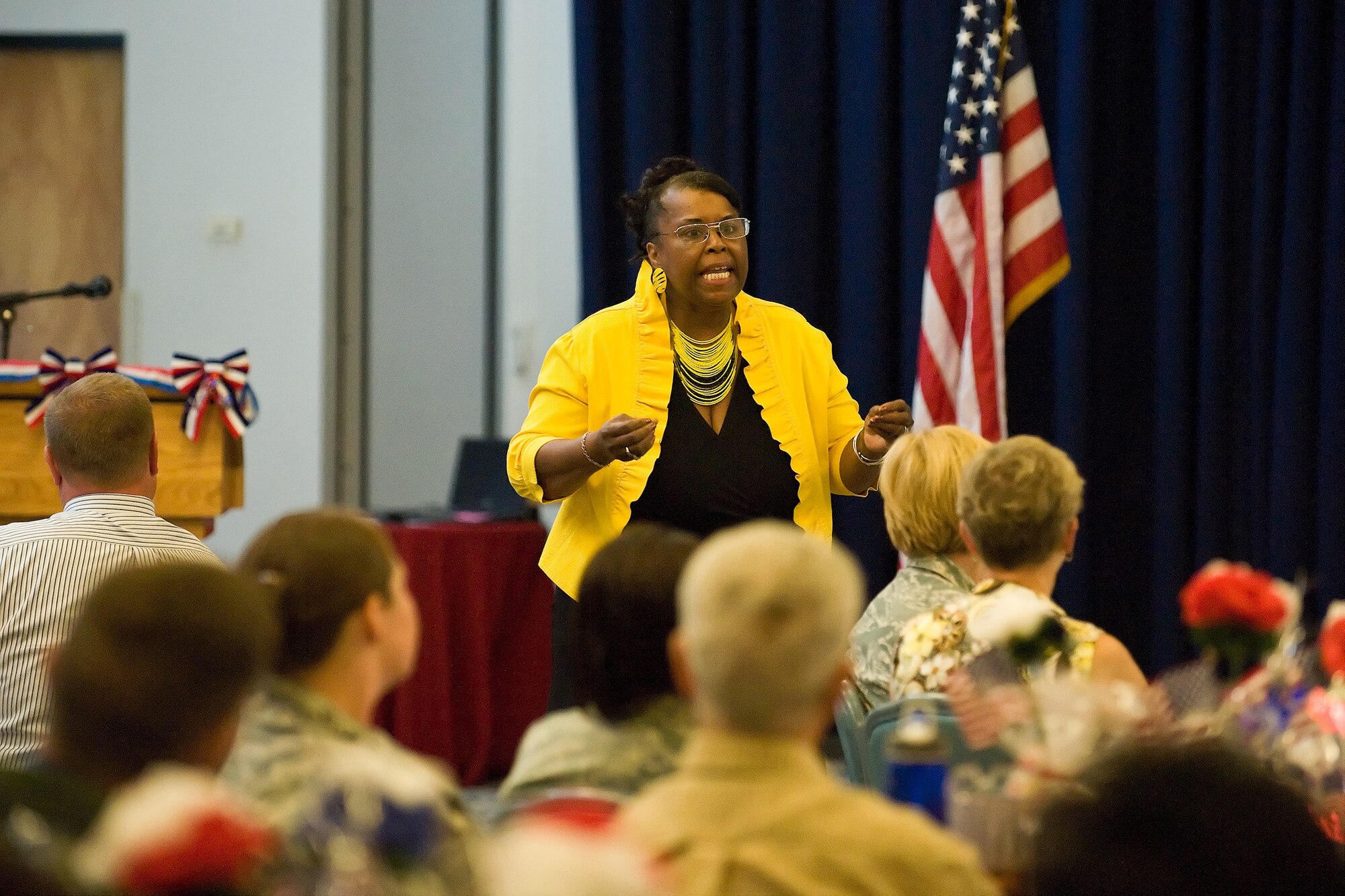 Patricia Edwards, 436th Force Support Squadron Airman and Family Readiness Center consultant, speaks at Volunteer Excellence Award ceremony, Dover Air Force Base, Del., July 6, 2010. The Volunteer agencies on Dover AFB consist of the Airman?s Attic, Airman & Family Readiness Center, Bravo, Base Museum, Chapel Services, Child Development Center, Drug Education for Youth, Enlisted Spouses Club, Officers Spouses Club, Welch Elementary School, DAFB Middles School, USO and DAFB Youth Center.   Volunteers on DAFB total more than 1,000 counting Uniformed Service Members.  (U.S. Air Force photo by Roland Balik/Released)
