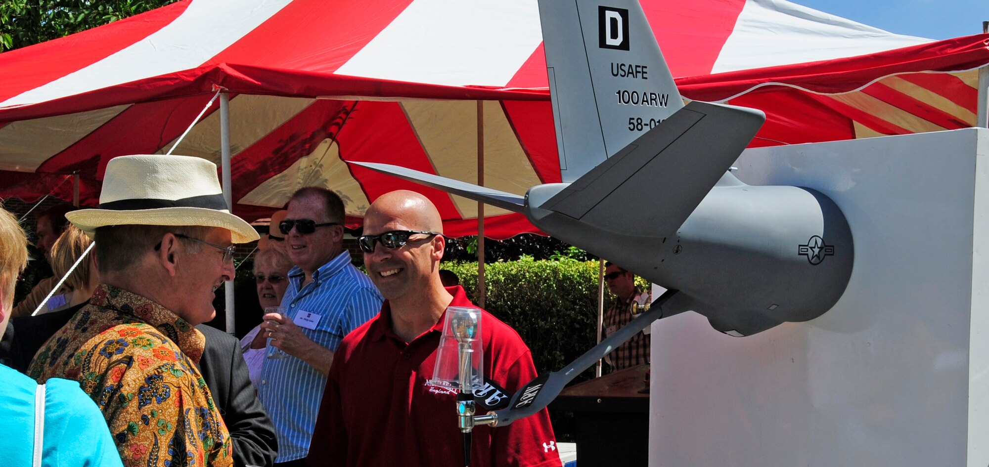 RAF MILDENHALL, England – Col. Chad Manske, 100th Air Refueling Wing commander, shares a laugh with local British dignitaries about the KC-135 Stratotanker boom tap at a barbeque at the colonel’s house July 10.  (U.S. Air Force photo/Staff Sgt. Christopher L. Ingersoll)