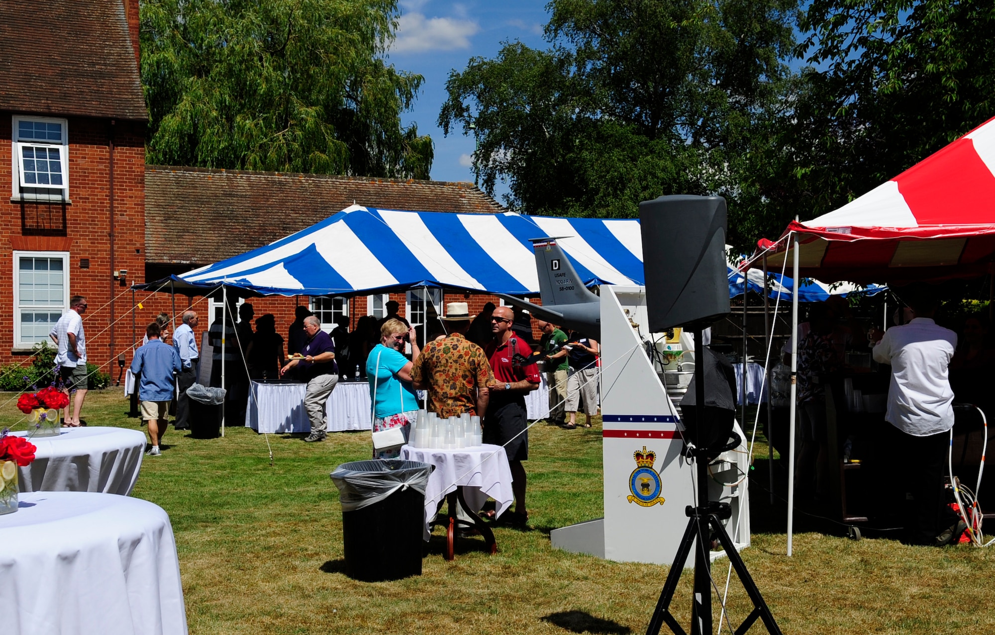 RAF MILDENHALL, England – Col. Chad Manske, 100th Air Refueling Wing commander, chats with local British guests at an all American barbeque July 10.  The event took place after a briefing designed to educate local British authorities about base functions and key leadership in order to strengthen ties with the community.  (U.S. Air Force photo/Staff Sgt. Christopher L. Ingersoll))