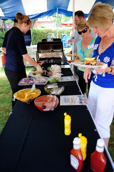 RAF MILDENHALL, England – Several commanders, spouses, and local dignitaries enjoy a classic American barbeque July 10, at 100th Air Refueling Wing Commander Col. Manske’s home at RAF Mildenhall.  The event was designed to inform and educate local authorities about base functions and key leadership.  (U.S. Air Force photo/Staff Sgt. Christopher L. Ingersoll)